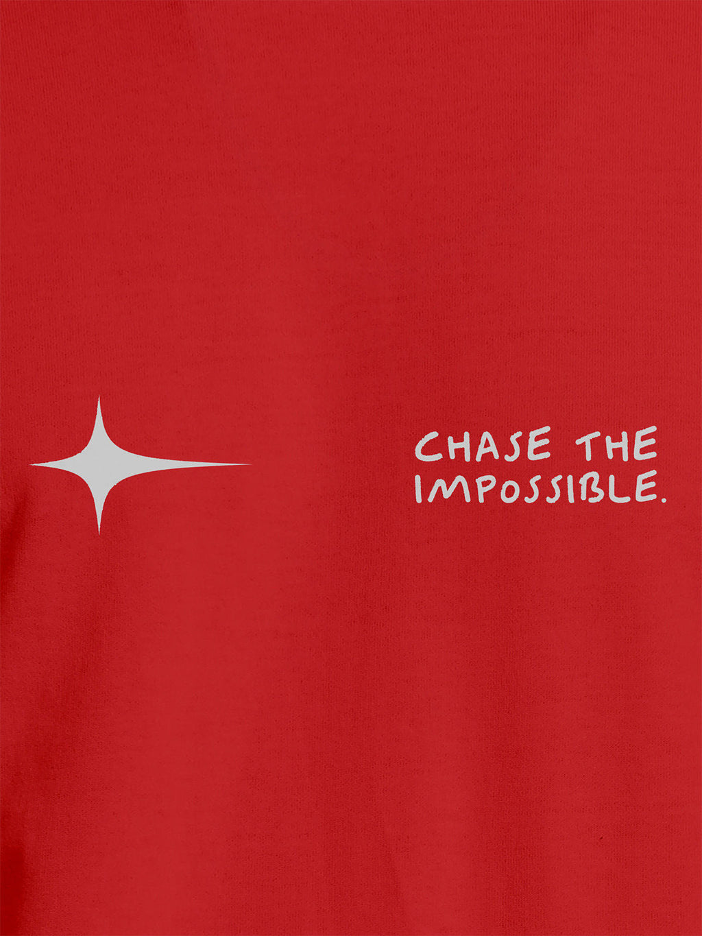 Close up of 'Chase The Impossible' design on Women's Red Round Neck T-shirt, highlighting intricate details and vibrant print.