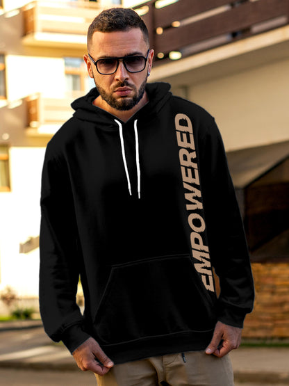 Model wearing Men's Black Hoodie Sweatshirt with 'Empowered' design, offering effortless style and premium comfort