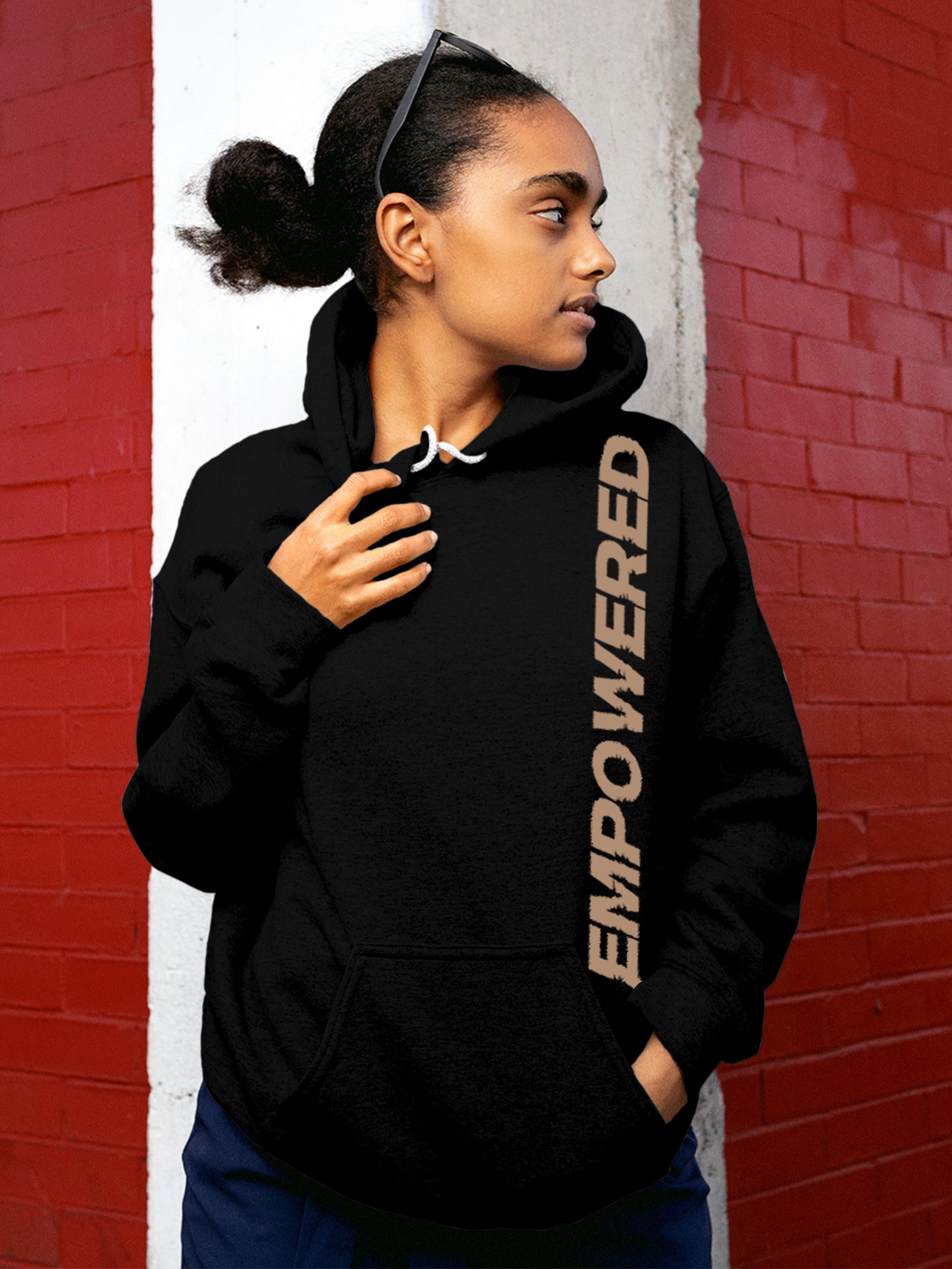 Model wearing Women's Black Hoodie Sweatshirt with 'Empowered' design, offering effortless style and premium comfort