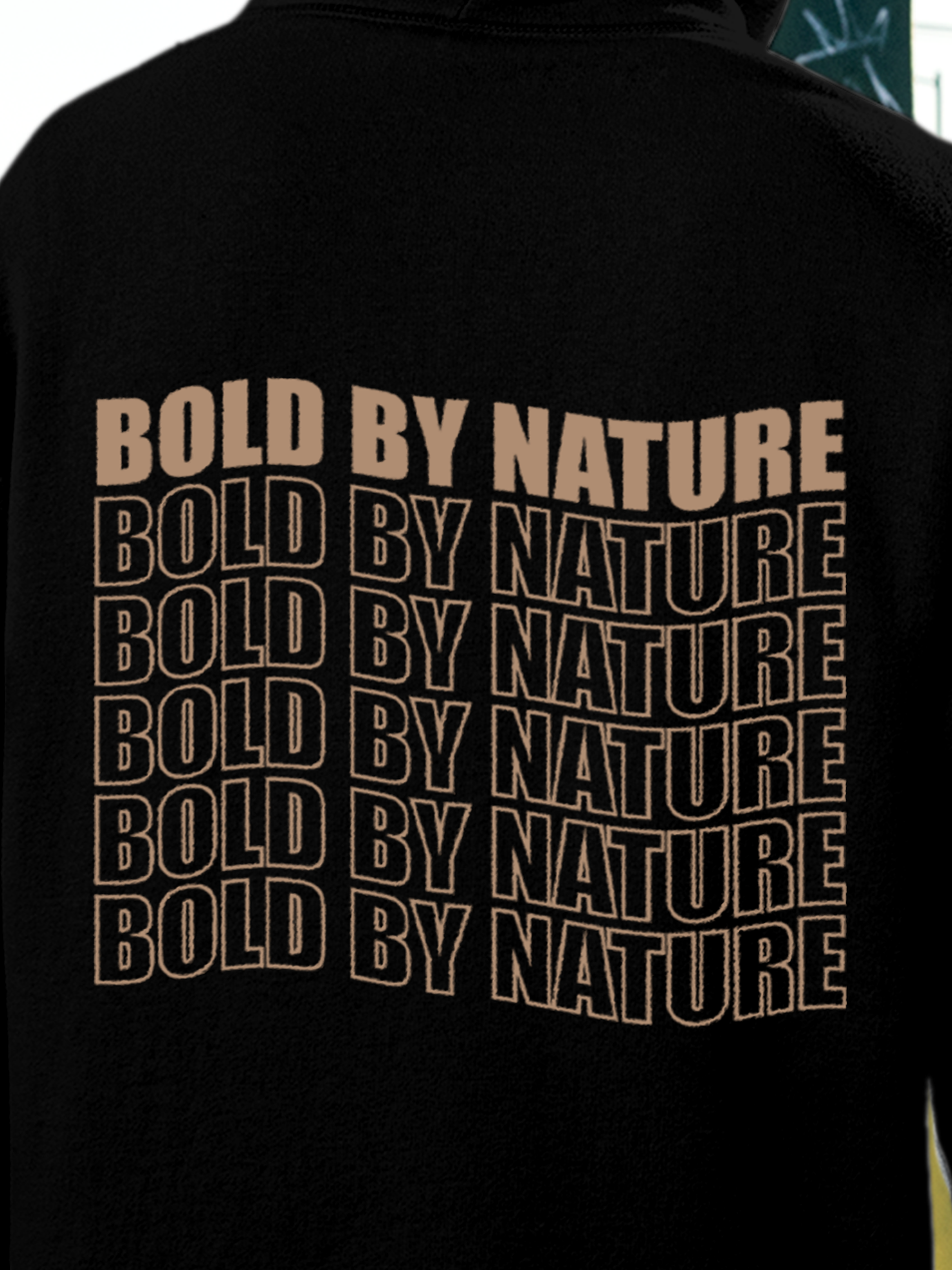 Close up of 'Bold By Nature' design on Men's Black Hoodie Sweatshirt, highlighting intricate details and vibrant print.