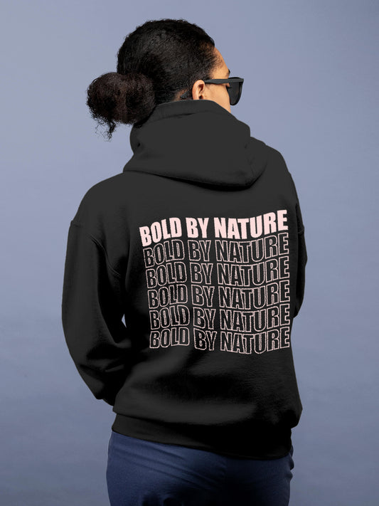 Model wearing Women's Dark Grey Hoodie Sweatshirt with 'Bold By Nature' design, offering effortless style and premium comfort