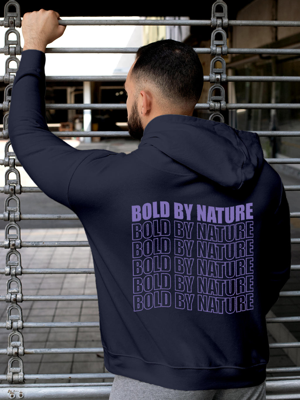 Model wearing Men's Navy Blue Hoodie Sweatshirt with 'Bold By Nature' design, offering effortless style and premium comfort