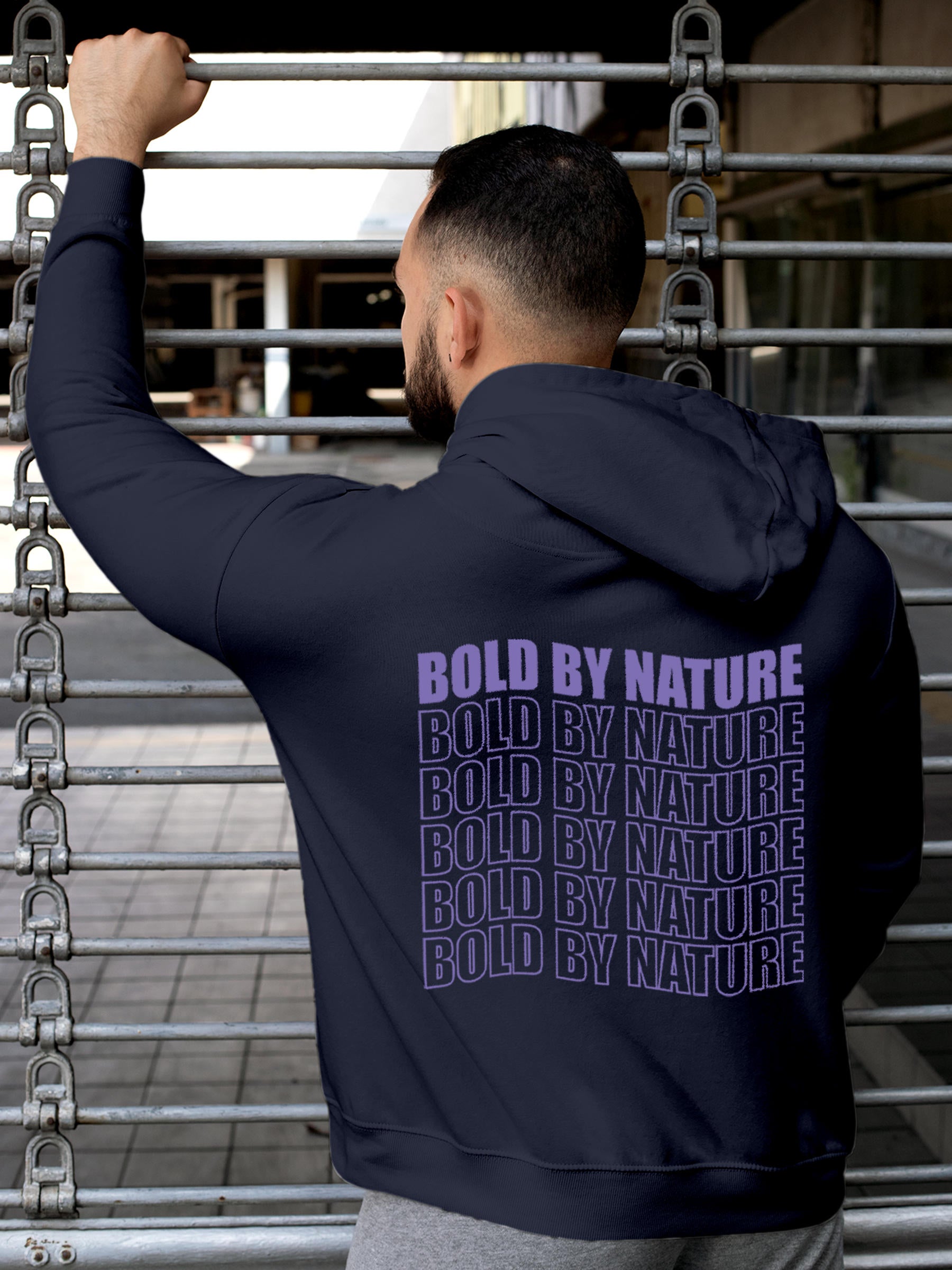 Model wearing Men's Navy Blue Hoodie Sweatshirt with 'Bold By Nature' design, offering effortless style and premium comfort