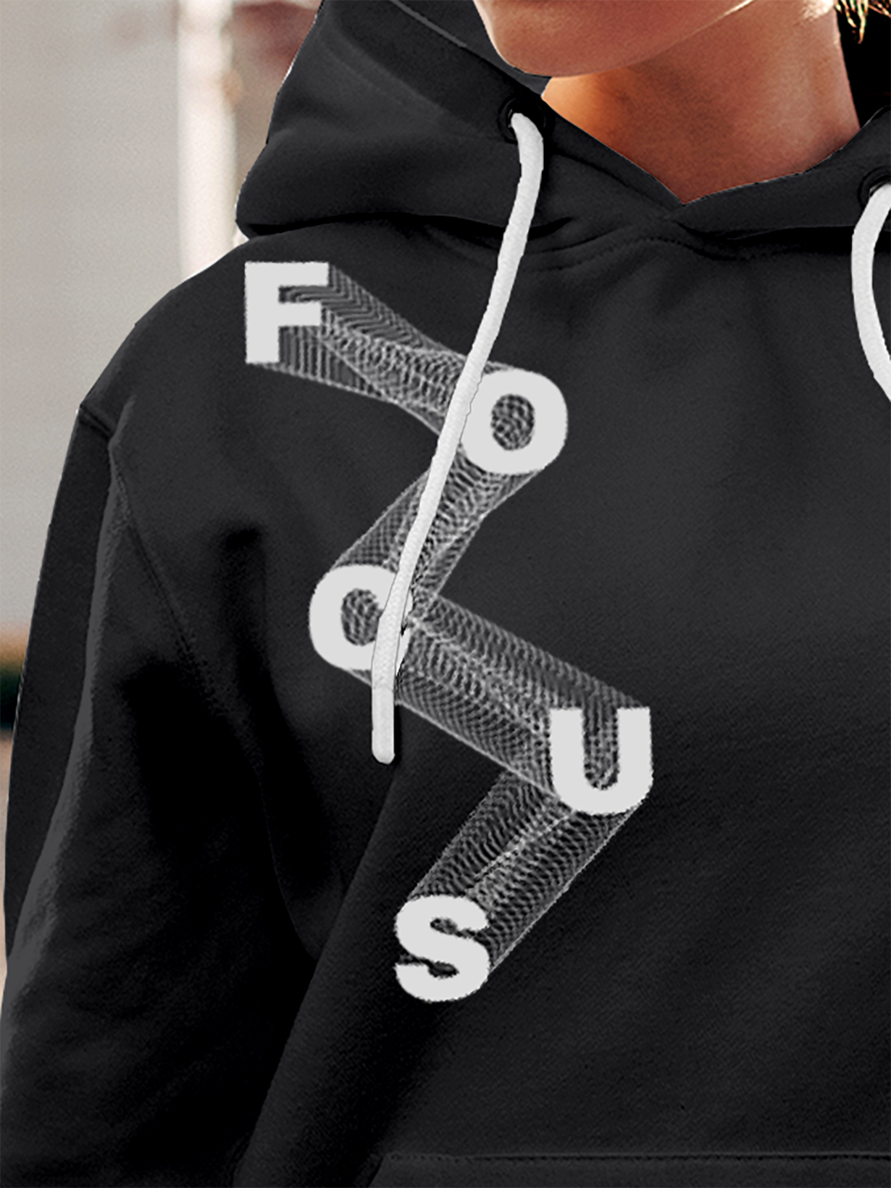 Close up of 'Focus' design on Women's Charcoal Grey Hoodie Sweatshirt, highlighting intricate details and vibrant print.