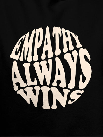Close up of 'Empathy Always Wins' design on Men's Black Hoodie Sweatshirt, highlighting intricate details and vibrant print.