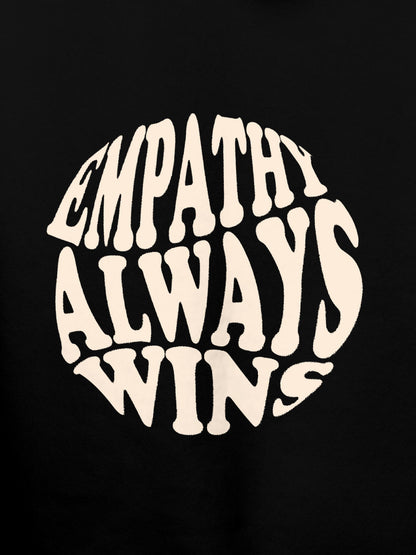 Close up of 'Empathy Always Wins' design on Women's Black Hoodie Sweatshirt, highlighting intricate details and vibrant print.