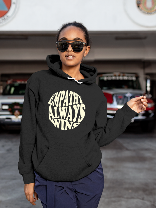 Fighterhero Hoodie Collection: Model wearing Women's Charcoal Grey Hoodie Sweatshirt with 'Empathy Always Wins' design