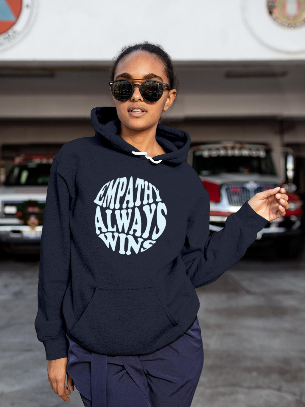 Model wearing Women's Navy Blue Hoodie Sweatshirt with 'Empathy Always Wins' design, offering effortless style and premium comfort