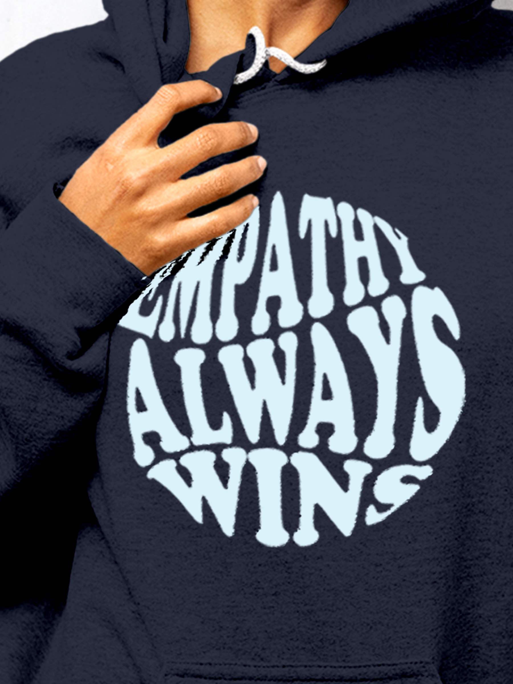 Close up of 'Empathy Always Wins' design on Women's Navy Blue Hoodie Sweatshirt, highlighting intricate details and vibrant print.