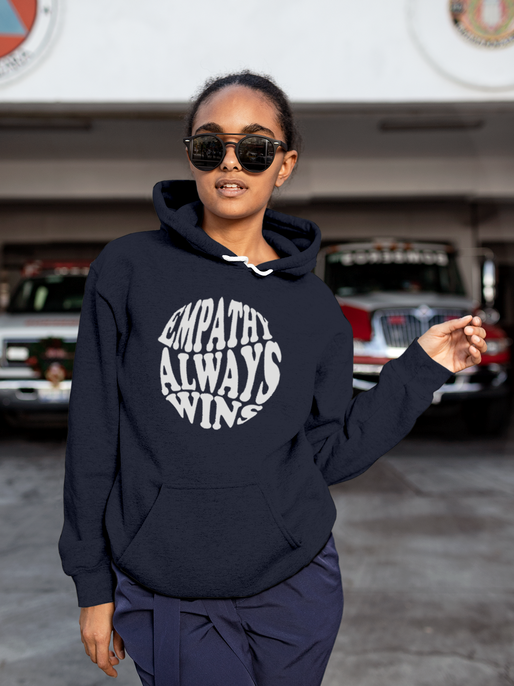 Model wearing Women's Navy Blue Hoodie Sweatshirt with 'Empathy Always Wins' design, offering effortless style and premium comfort