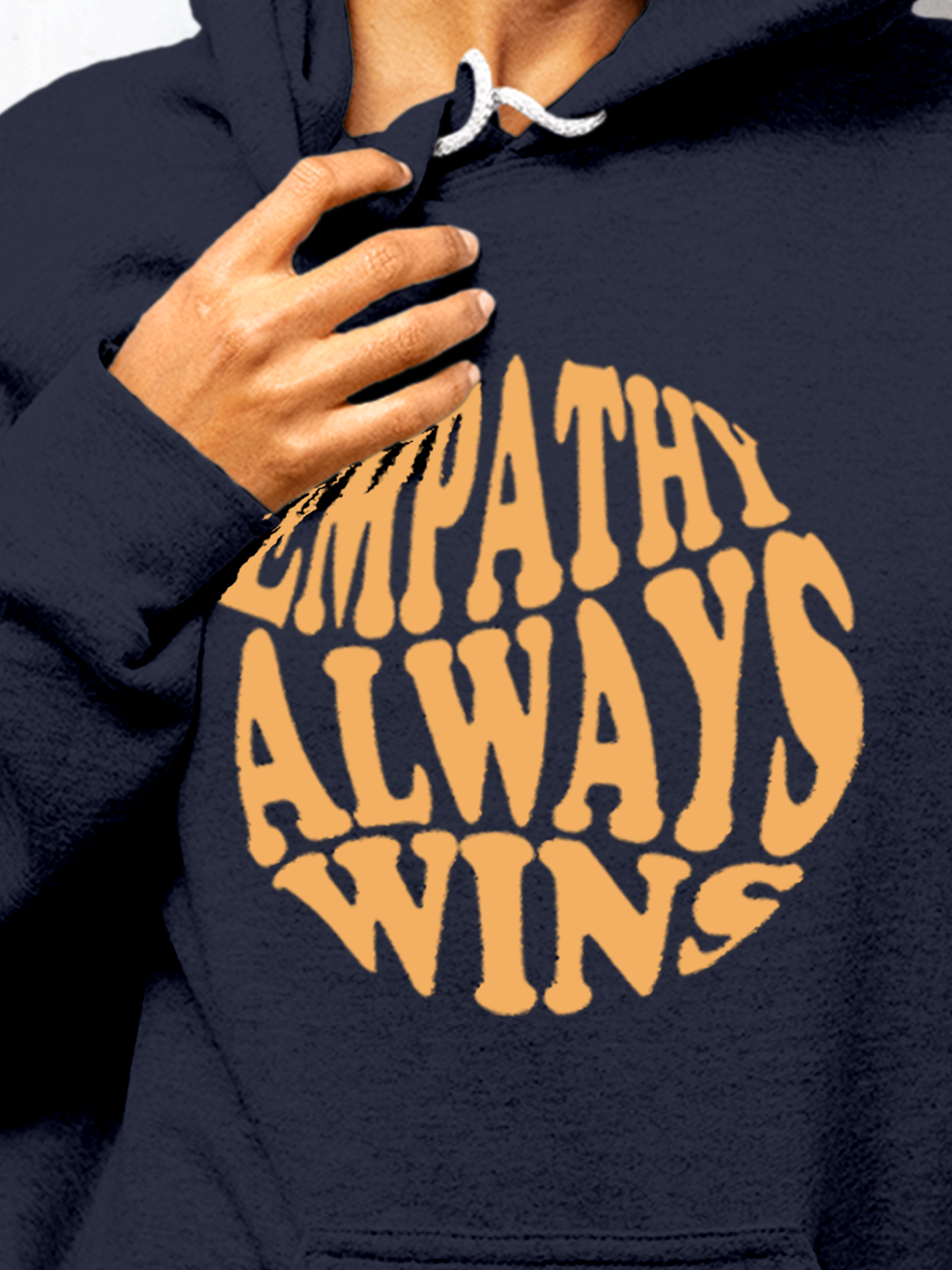Close up of 'Empathy Always Wins' design on Women's Navy Blue Hoodie Sweatshirt, highlighting intricate details and vibrant print.