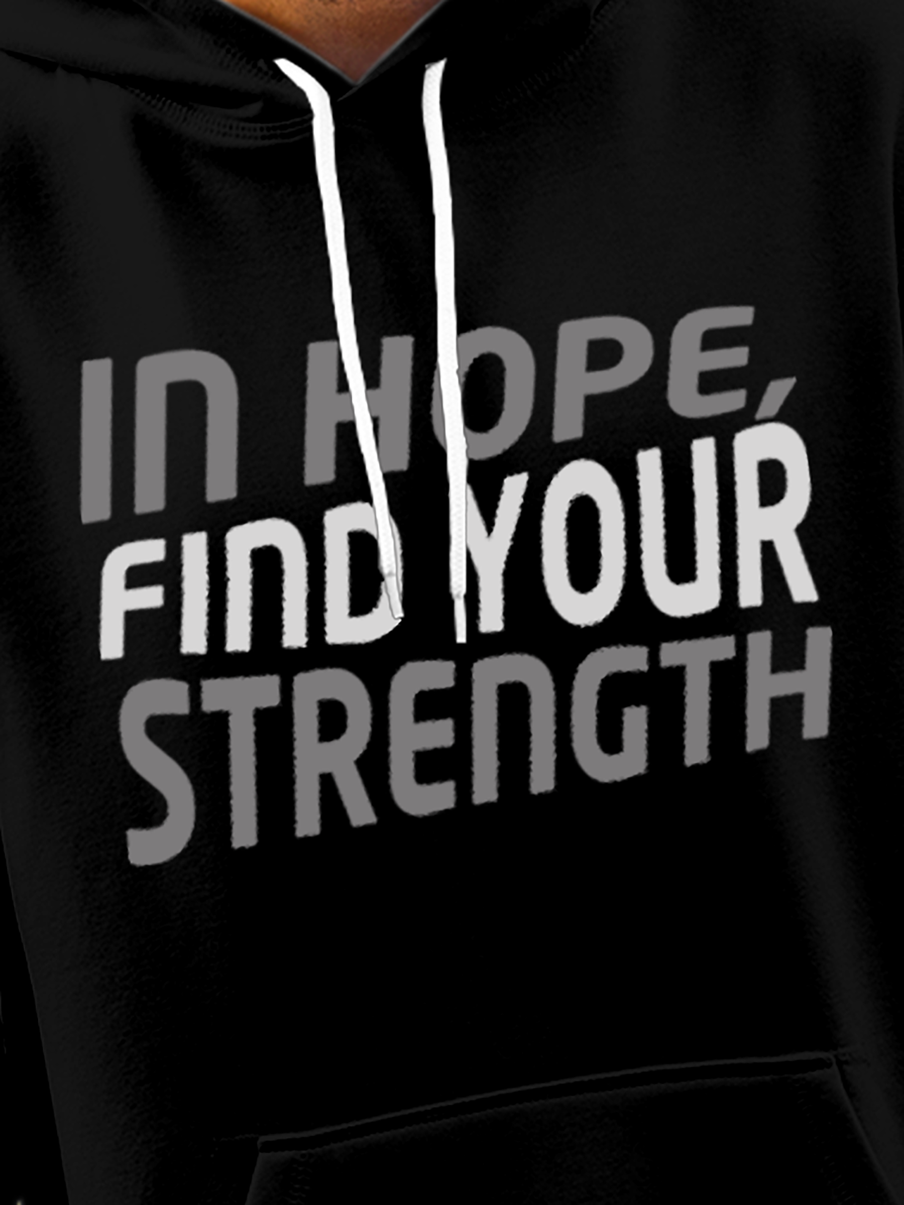 Close up of 'In Hope, Find Your Strength' design on Men's Black Hoodie Sweatshirt, highlighting intricate details and vibrant print.