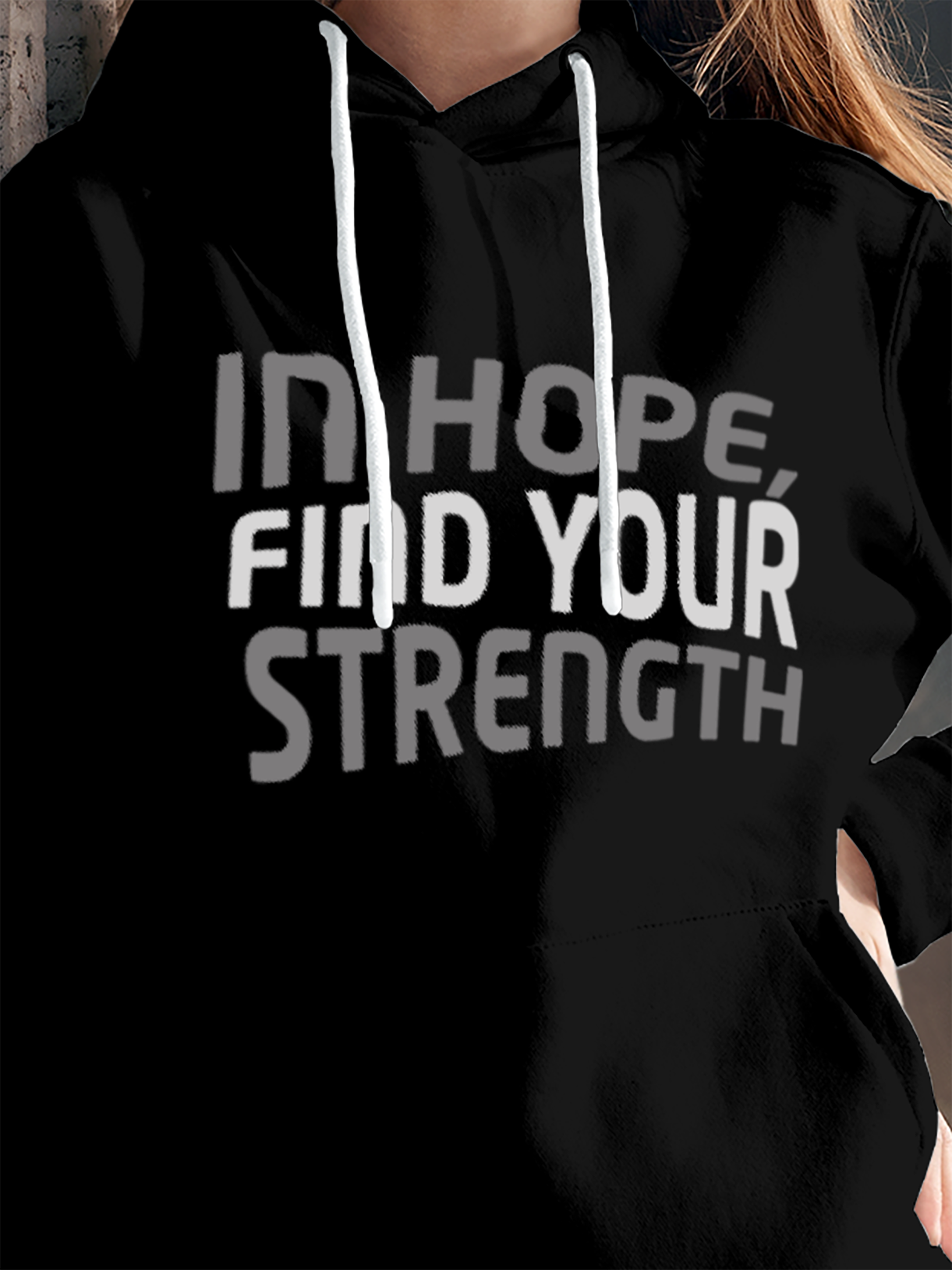 Close up of 'In Hope, Find Your Strength' design on Women's Black Hoodie Sweatshirt, highlighting intricate details and vibrant print.