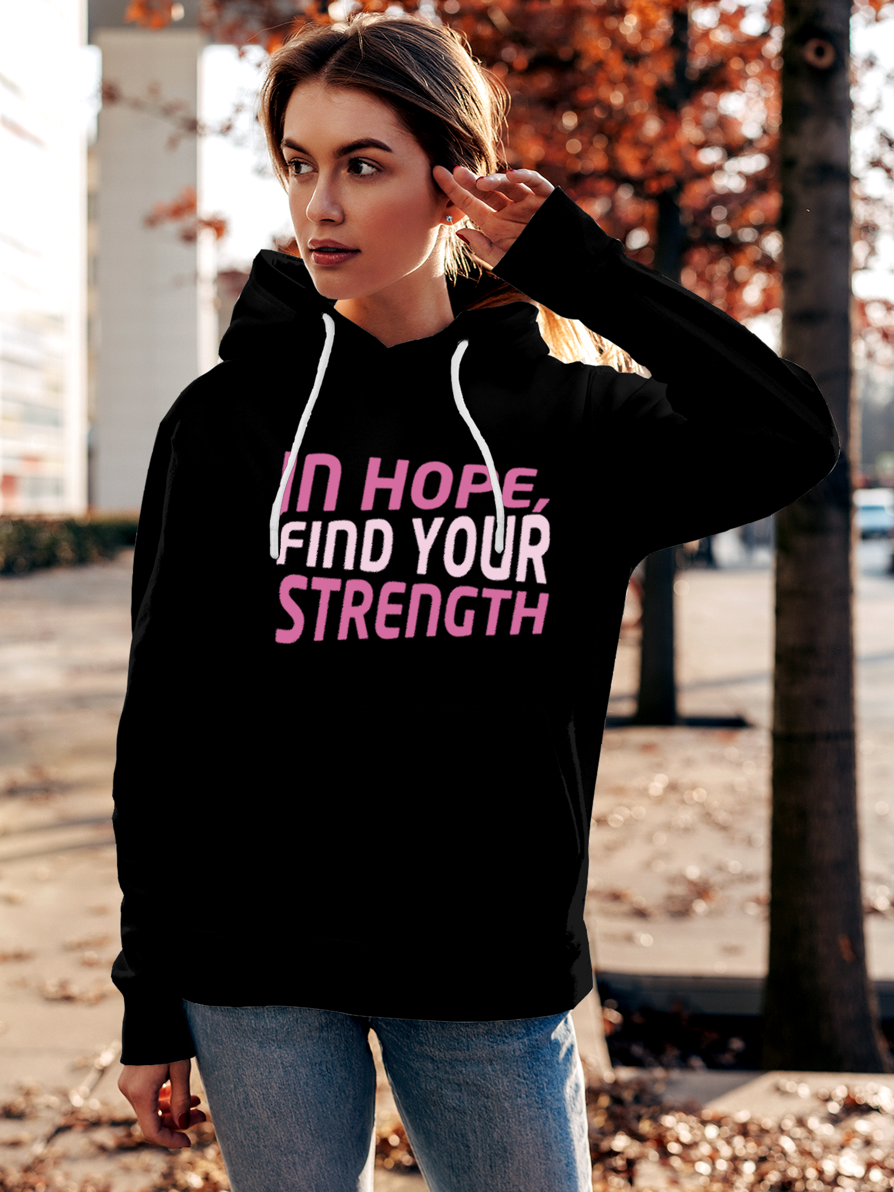 Fighterhero Hoodie Collection: Model wearing Women's Black Hoodie Sweatshirt with 'In Hope, Find Your Strength' design