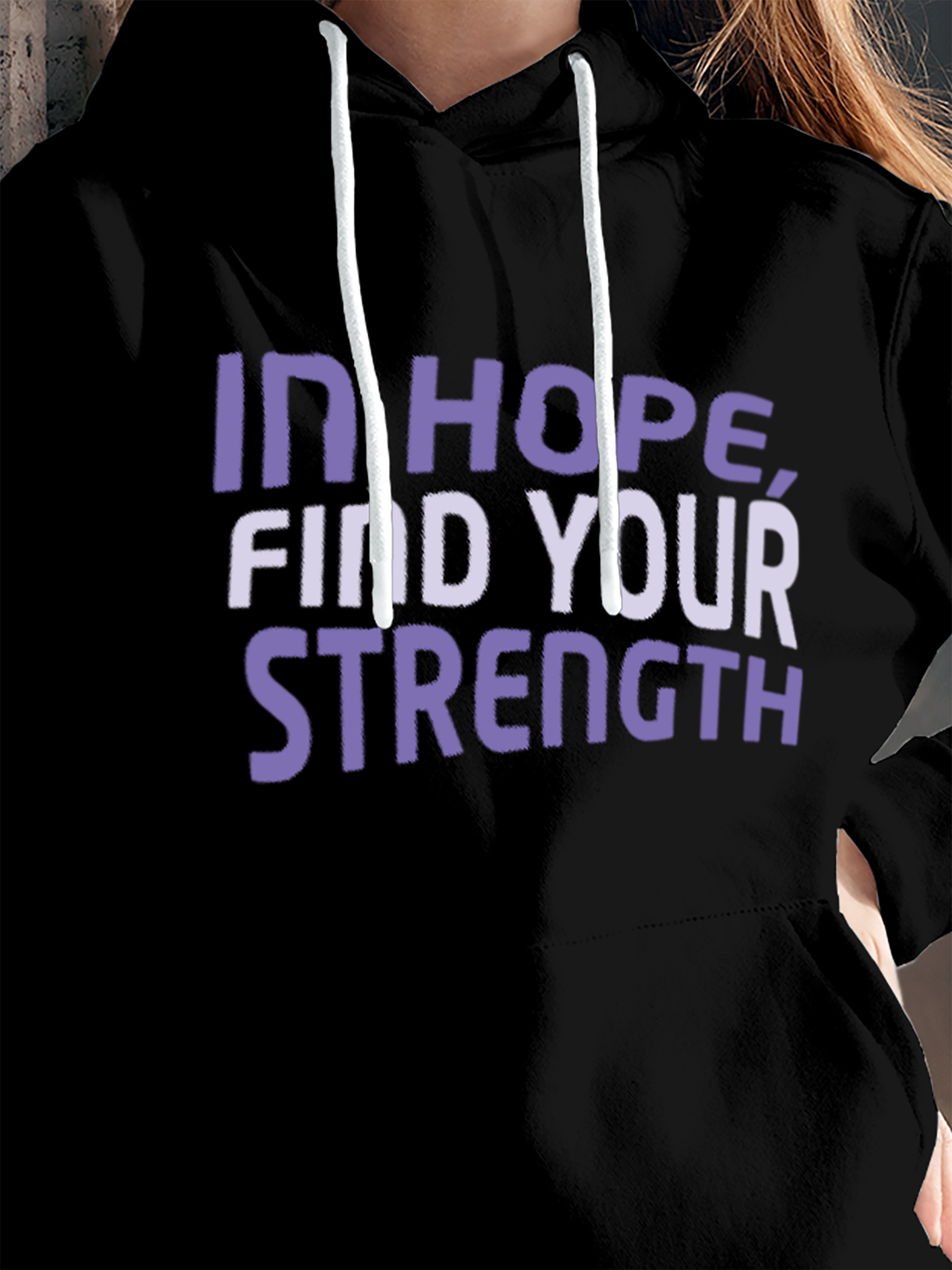 Close up of 'In Hope, Find Your Strength' design on Women's Black Hoodie Sweatshirt, highlighting intricate details and vibrant print.