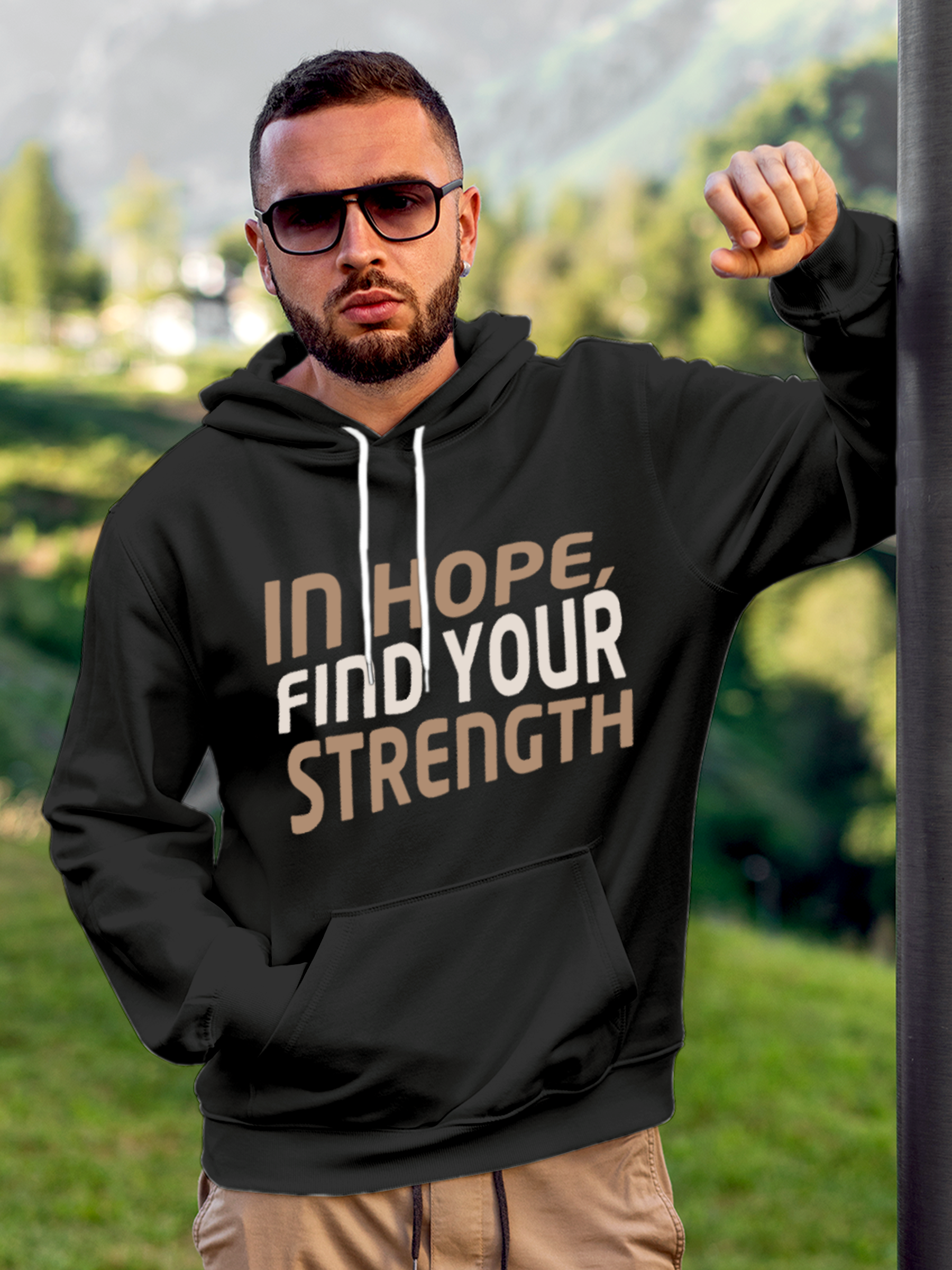 Model wearing Men's Charcoal Grey Hoodie Sweatshirt with 'In Hope, Find Your Strength' design, offering effortless style and premium comfort