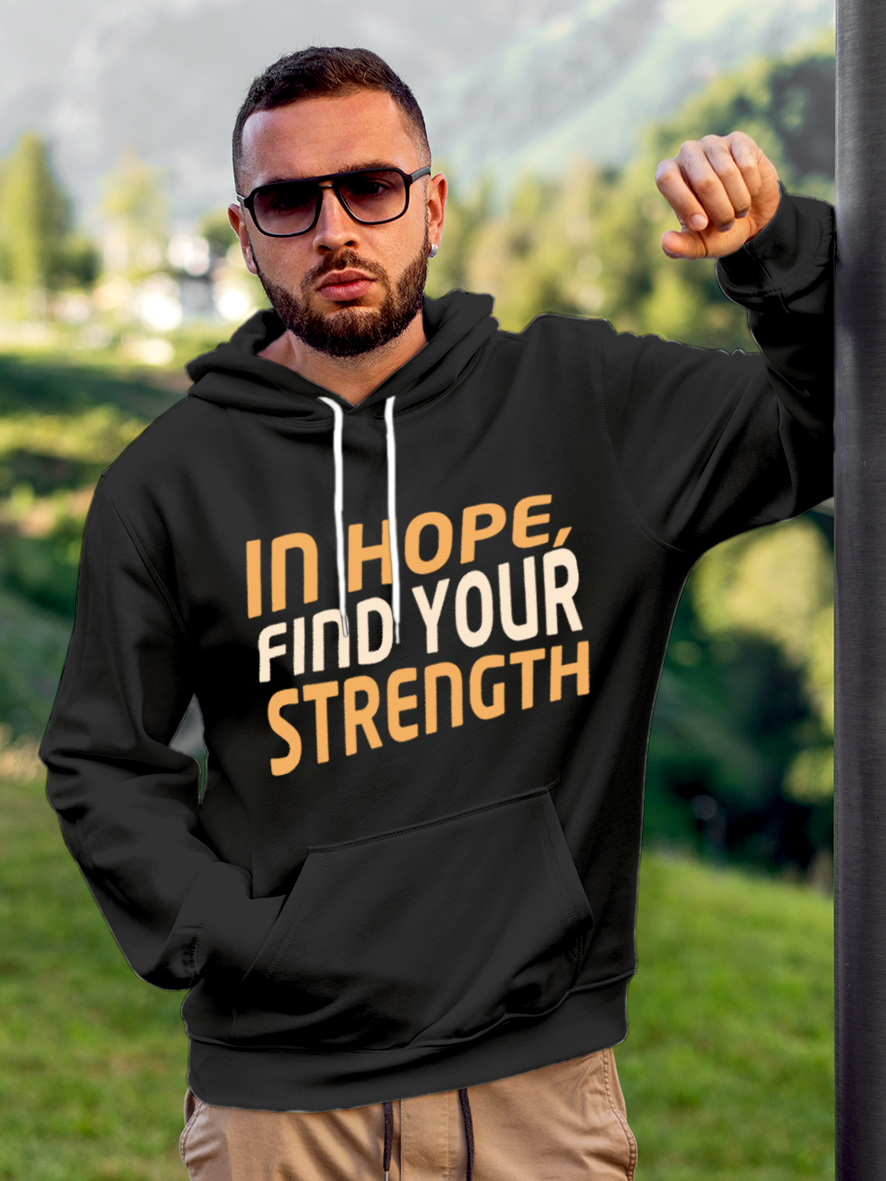 Model wearing Men's Charcoal Grey Hoodie Sweatshirt with 'In Hope, Find Your Strength' design, offering effortless style and premium comfort