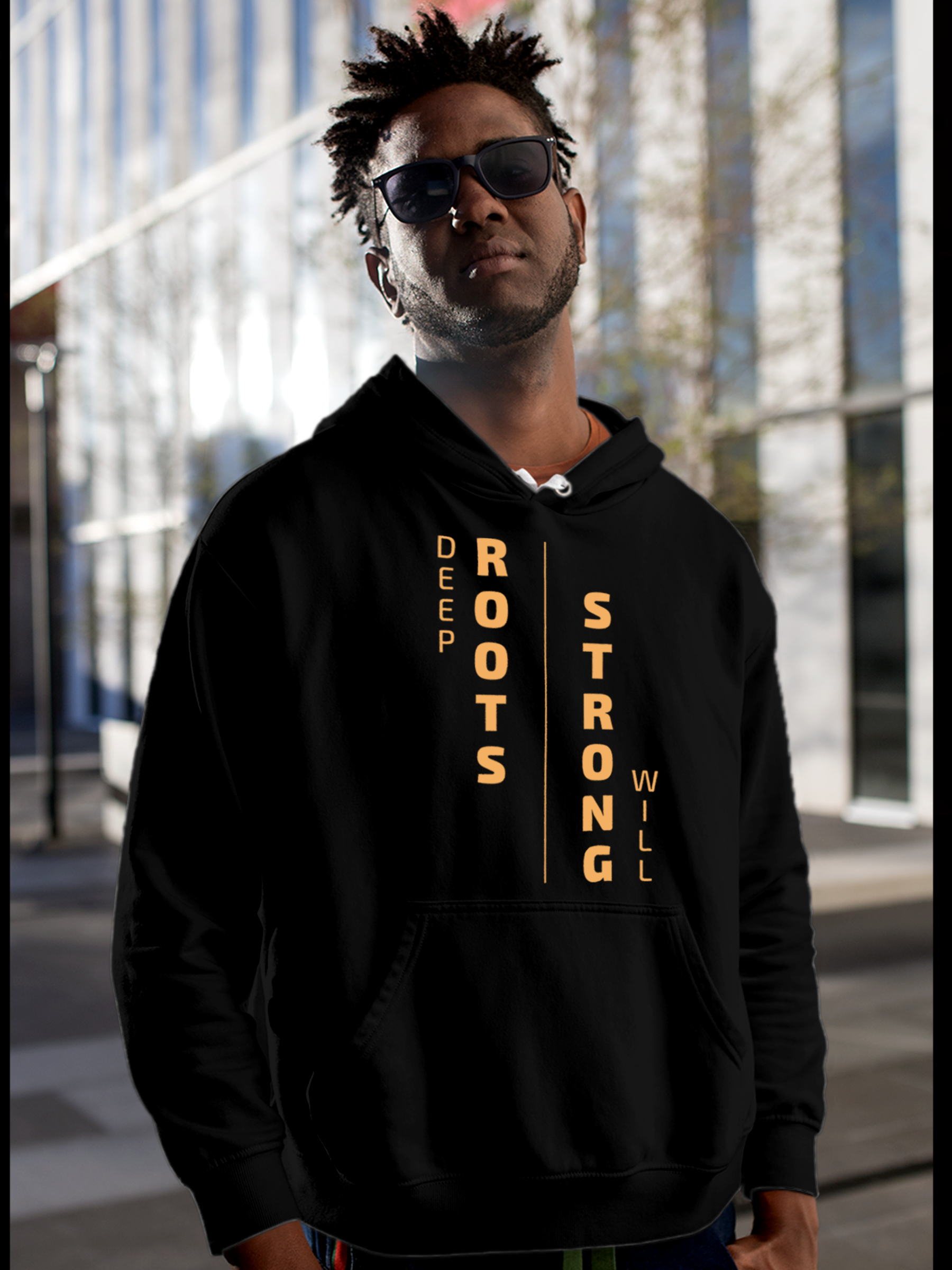Fighterhero Hoodie Collection: Model wearing Men's Black Hoodie Sweatshirt with 'Deep Roots Strong Will' design