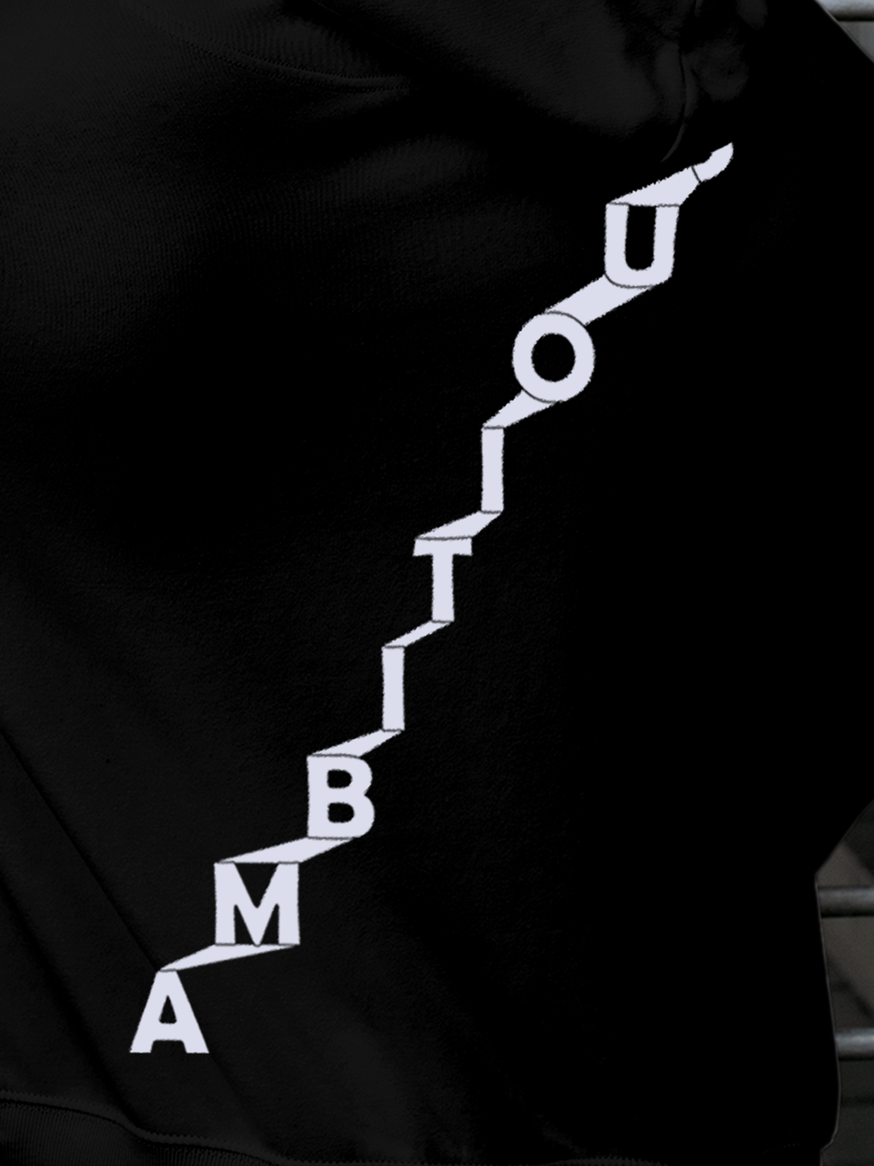 Close up of 'Ambitious' design on Men's Black Hoodie Sweatshirt, highlighting intricate details and vibrant print.