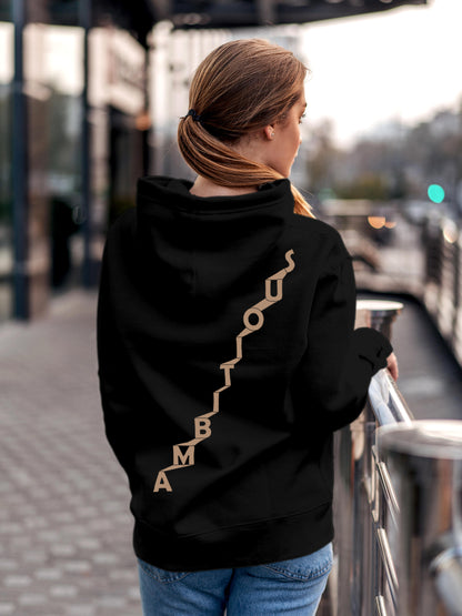 Model wearing Women's Black Hoodie Sweatshirt with 'Ambitious' design, offering effortless style and premium comfort