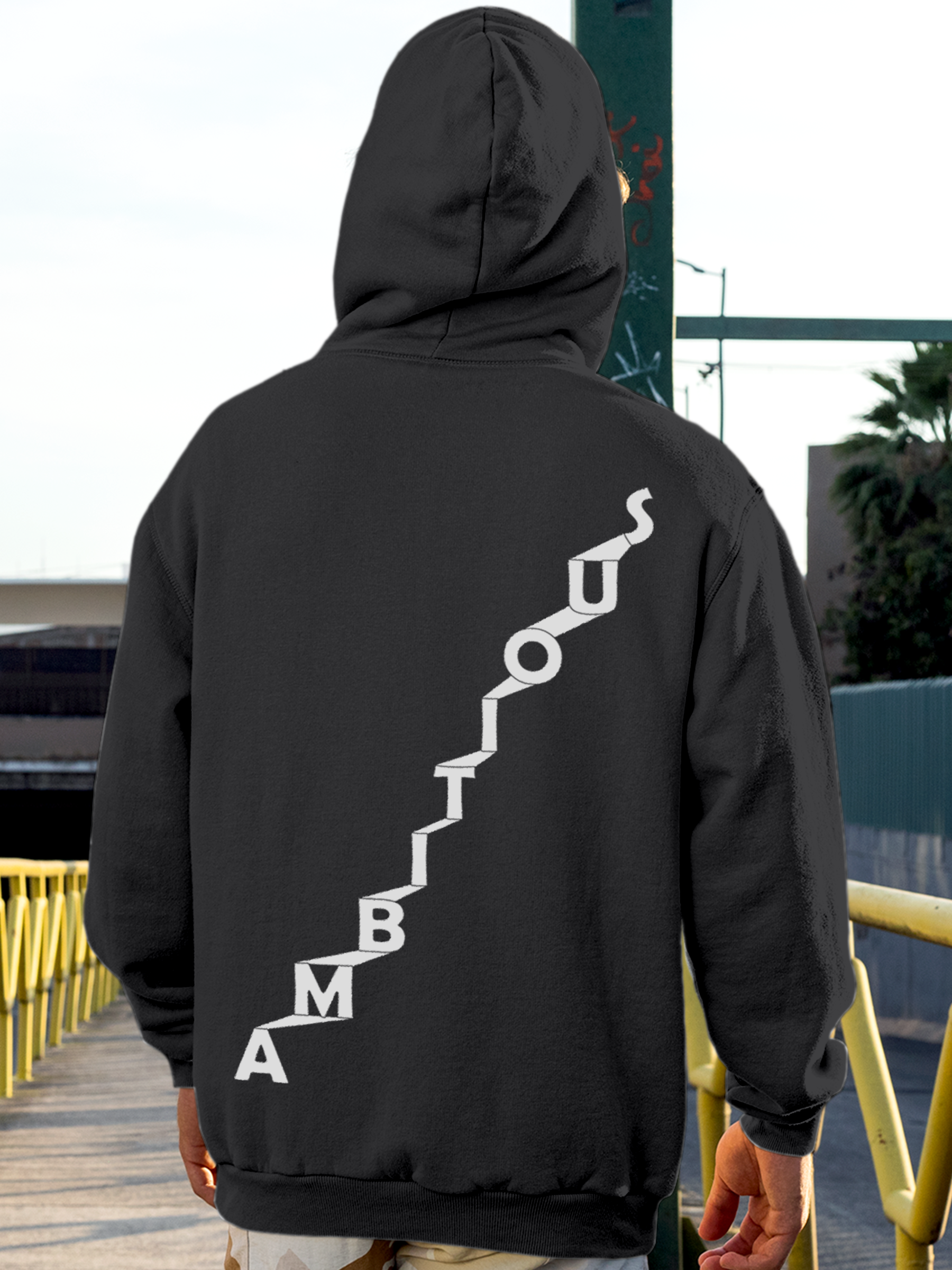 Model wearing Men's Charcoal Grey Hoodie Sweatshirt with 'Ambitious' design, offering effortless style and premium comfort