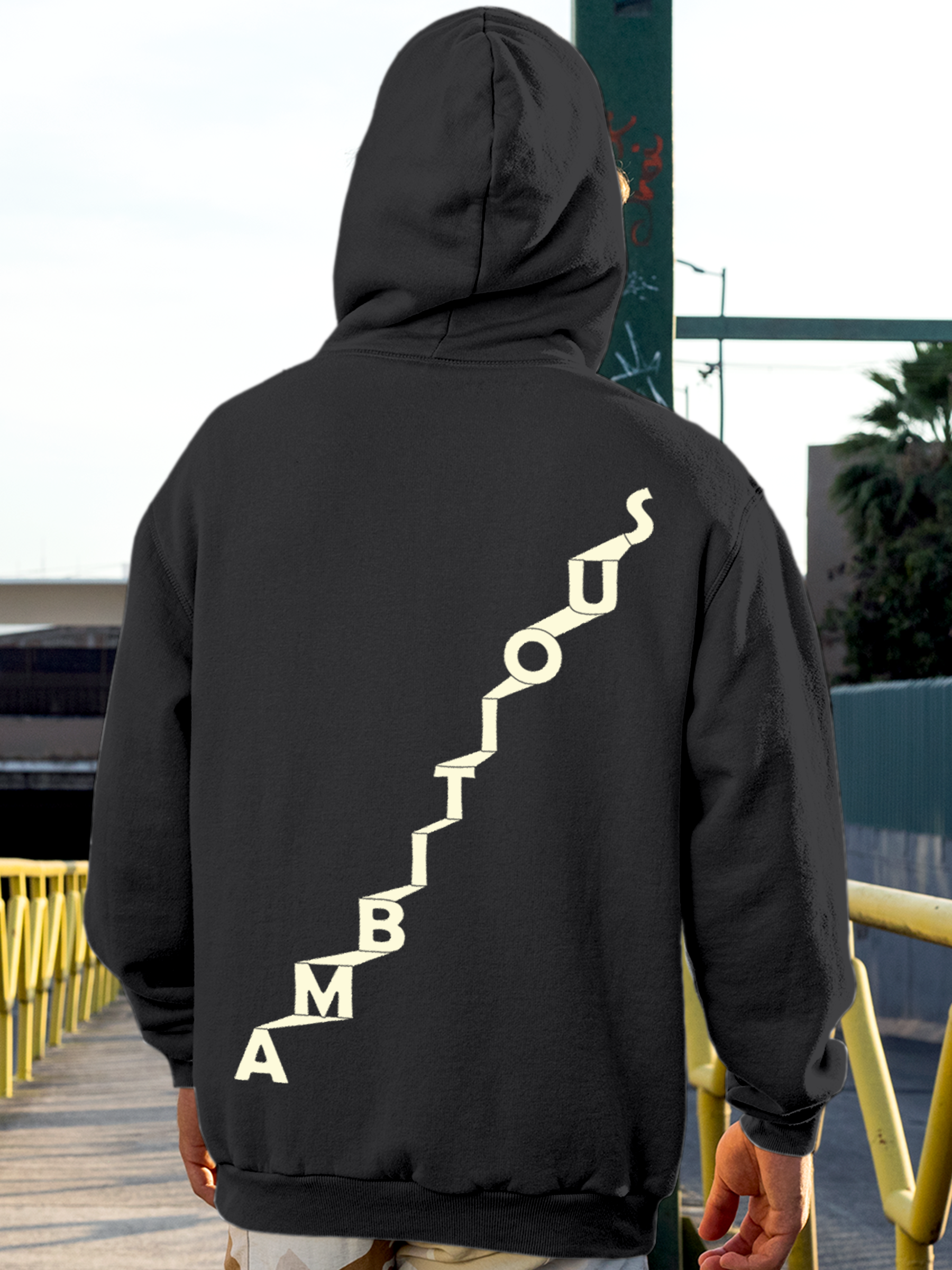 Model wearing Men's Charcoal Grey Hoodie Sweatshirt with 'Ambitious' design, offering effortless style and premium comfort