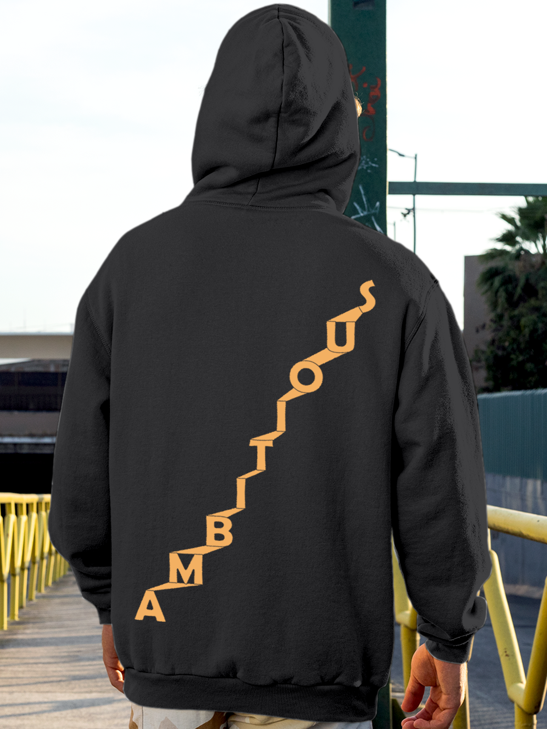 Fighterhero Hoodie Collection: Model wearing Men's Charcoal Grey Hoodie Sweatshirt with 'Ambitious' design