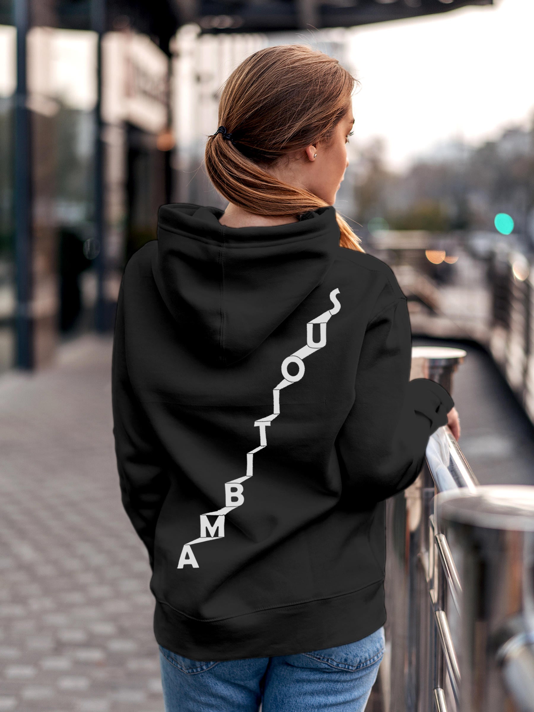 Model wearing Women's Dark Grey Hoodie Sweatshirt with 'Ambitious' design, offering effortless style and premium comfort