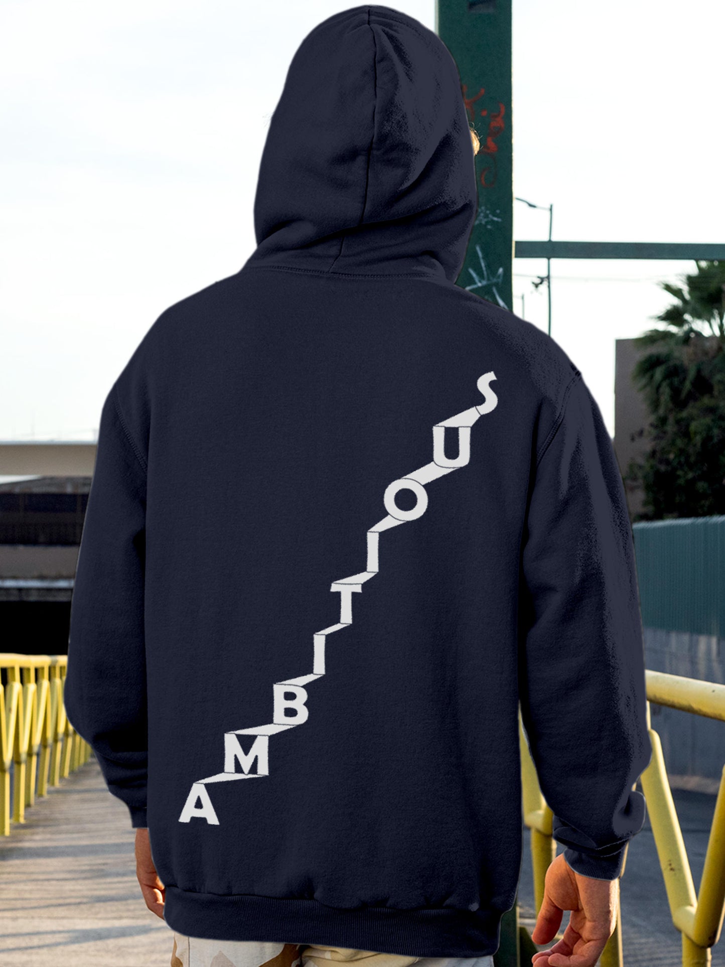 Model wearing Men's Navy Blue Hoodie Sweatshirt with 'Ambitious' design, offering effortless style and premium comfort