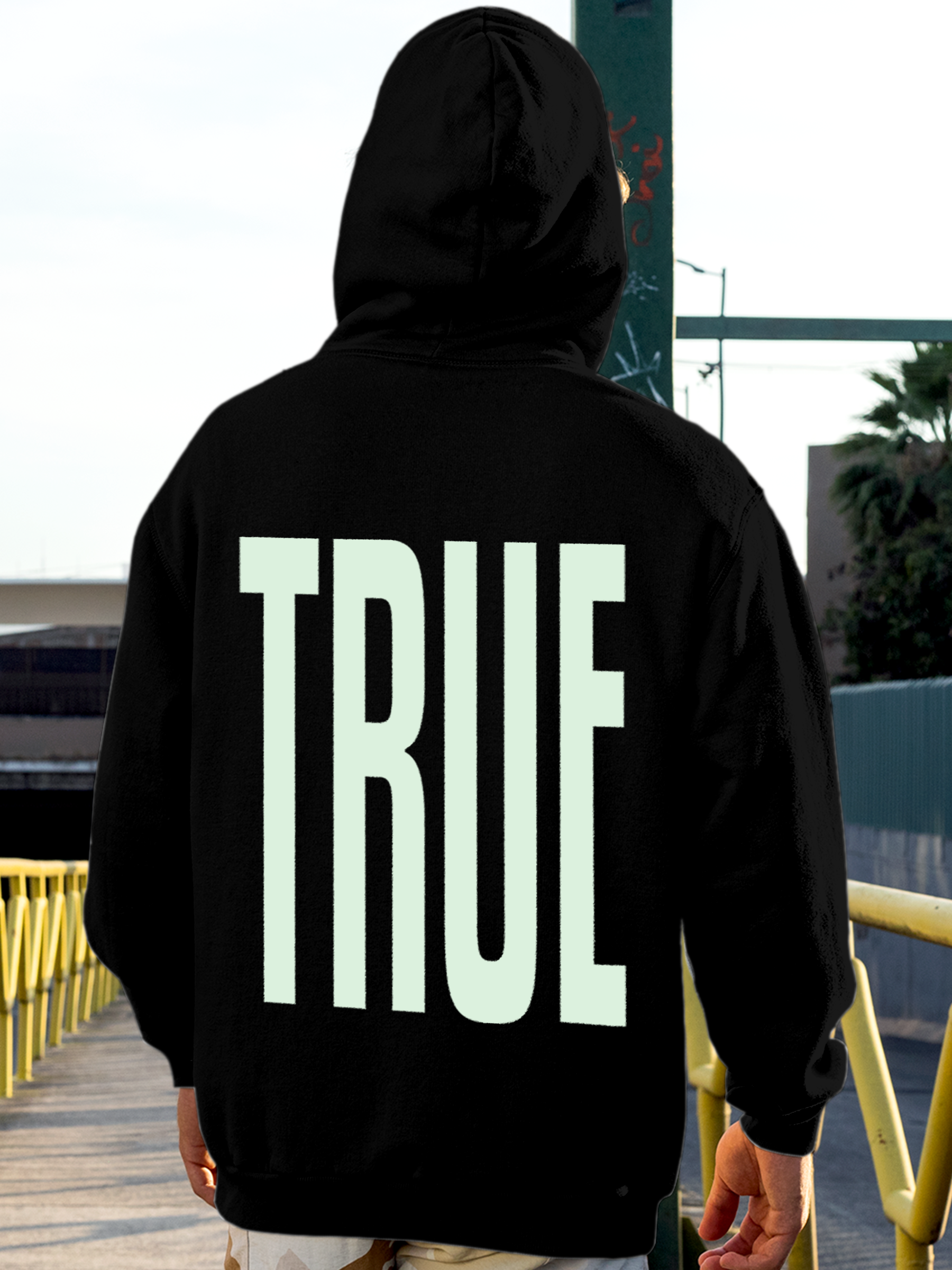 Model wearing Men's Black Hoodie Sweatshirt with 'Truth' design, offering effortless style and premium comfort