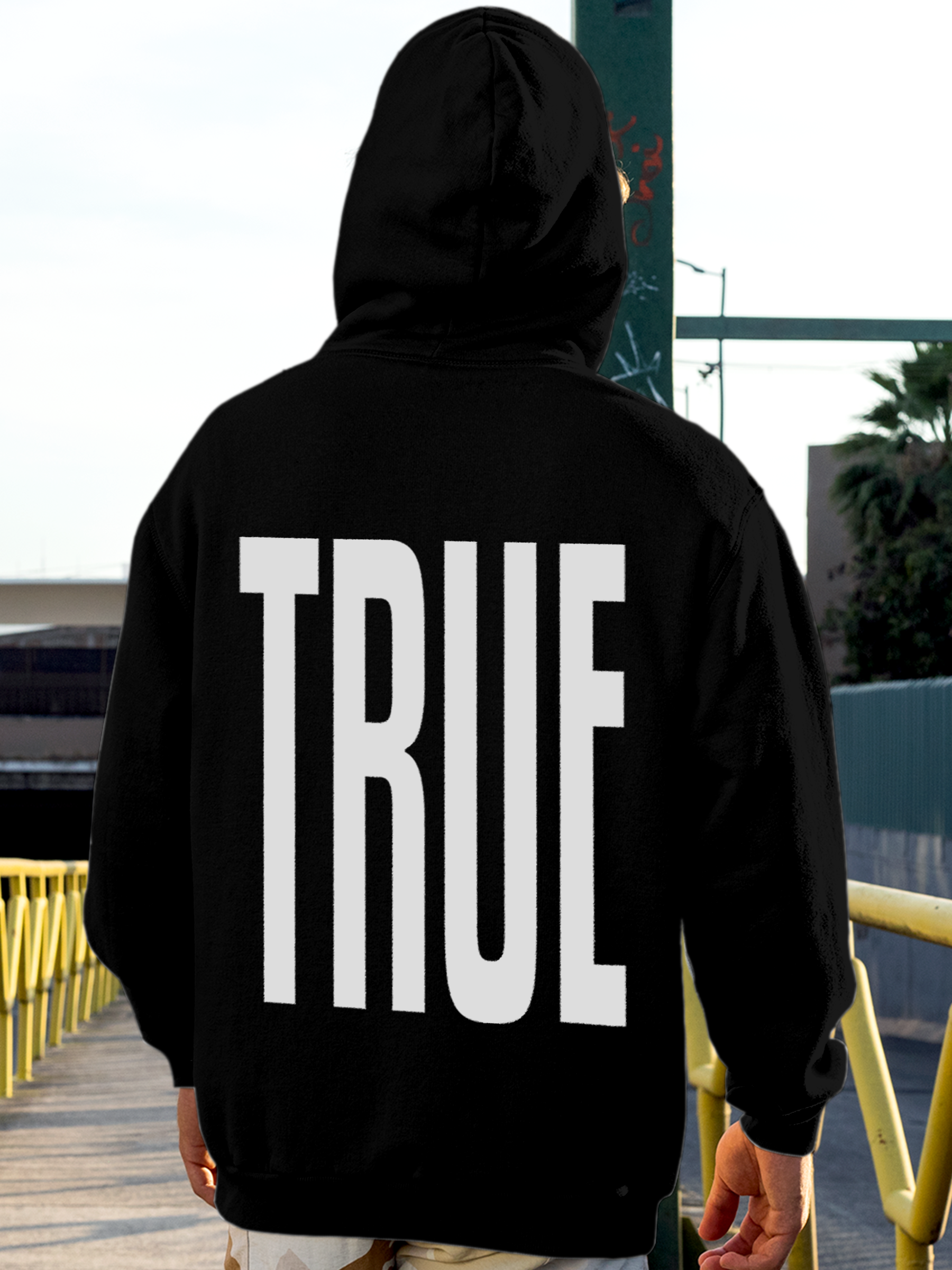 Model wearing Men's Black Hoodie Sweatshirt with 'Truth' design, offering effortless style and premium comfort