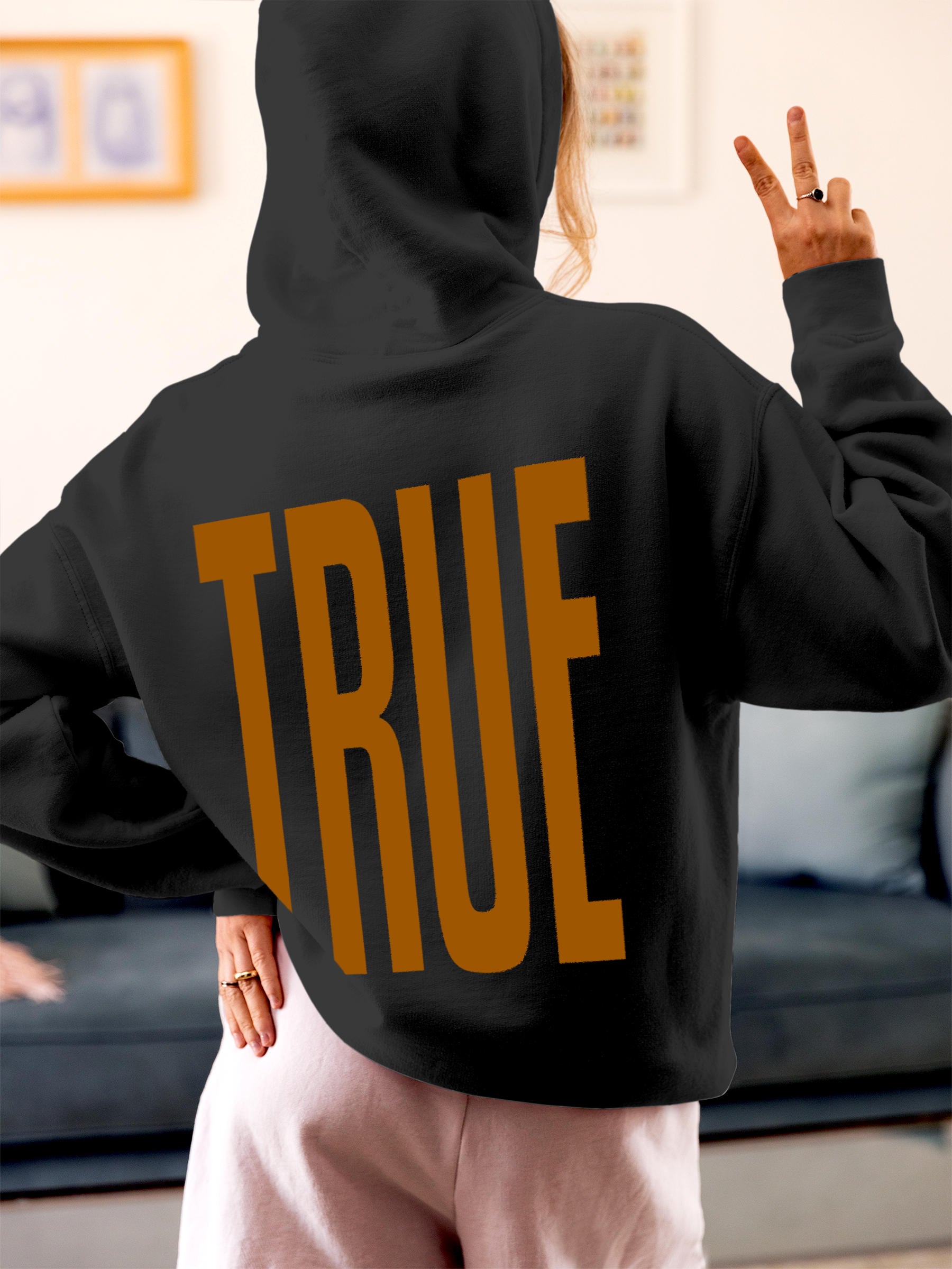 Model wearing Women's Dark Grey Hoodie Sweatshirt with 'Truth' design, offering effortless style and premium comfort