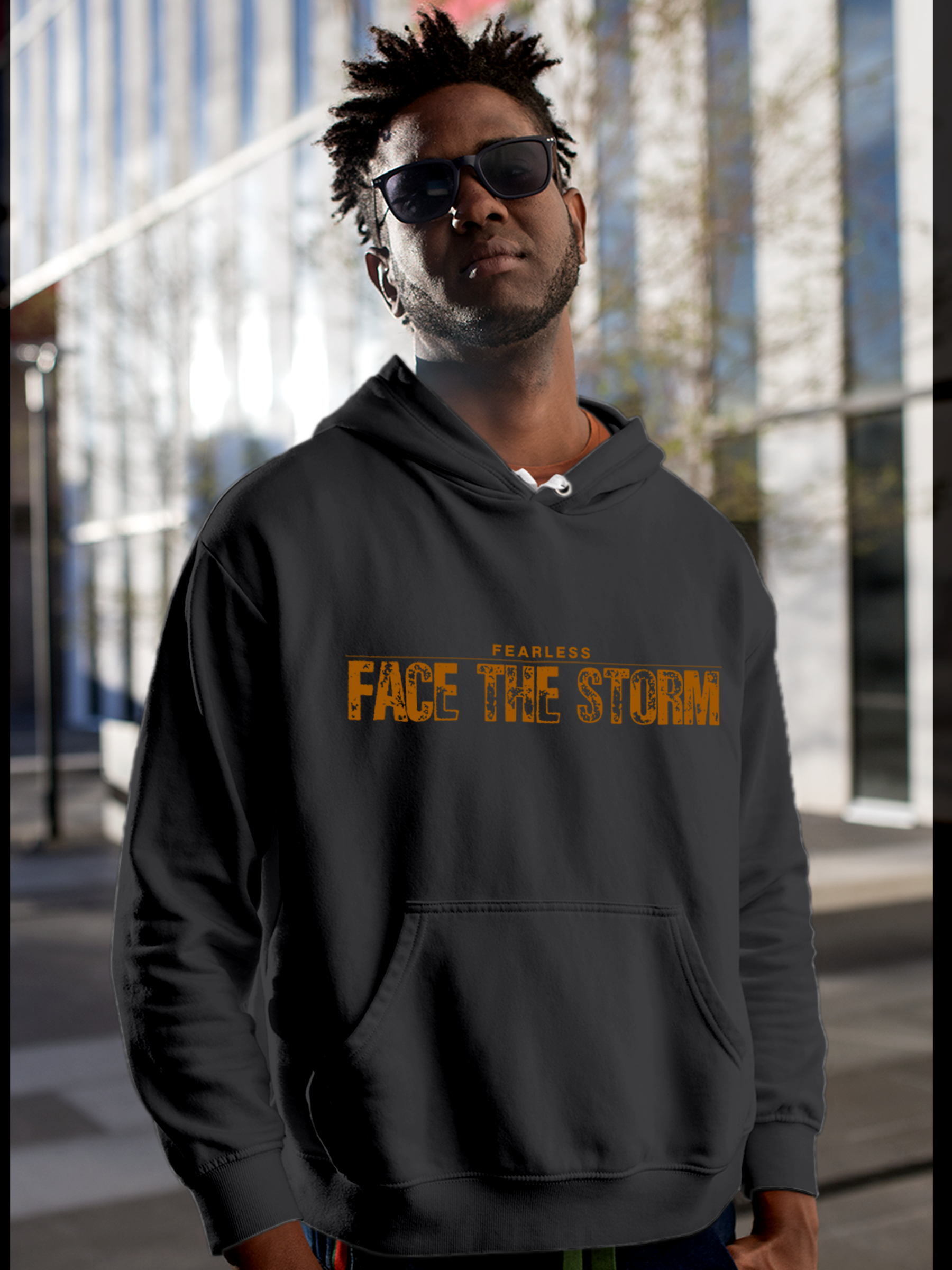 Model wearing Men's Charcoal Grey Hoodie Sweatshirt with 'Fearless. Face the Storm' design, offering effortless style and premium comfort