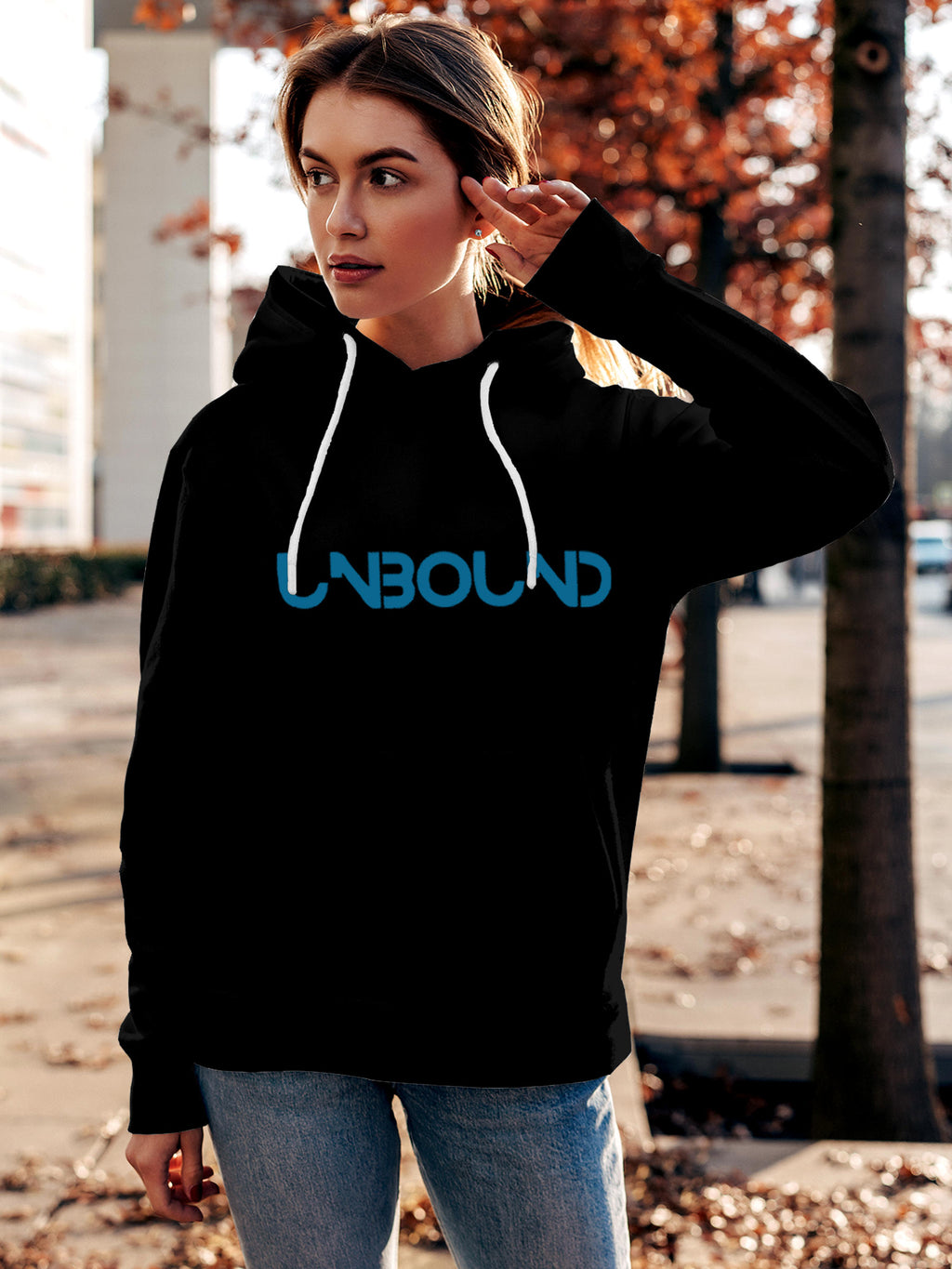 Model wearing Women's Black Hoodie Sweatshirt with 'Unbound' design, offering effortless style and premium comfort