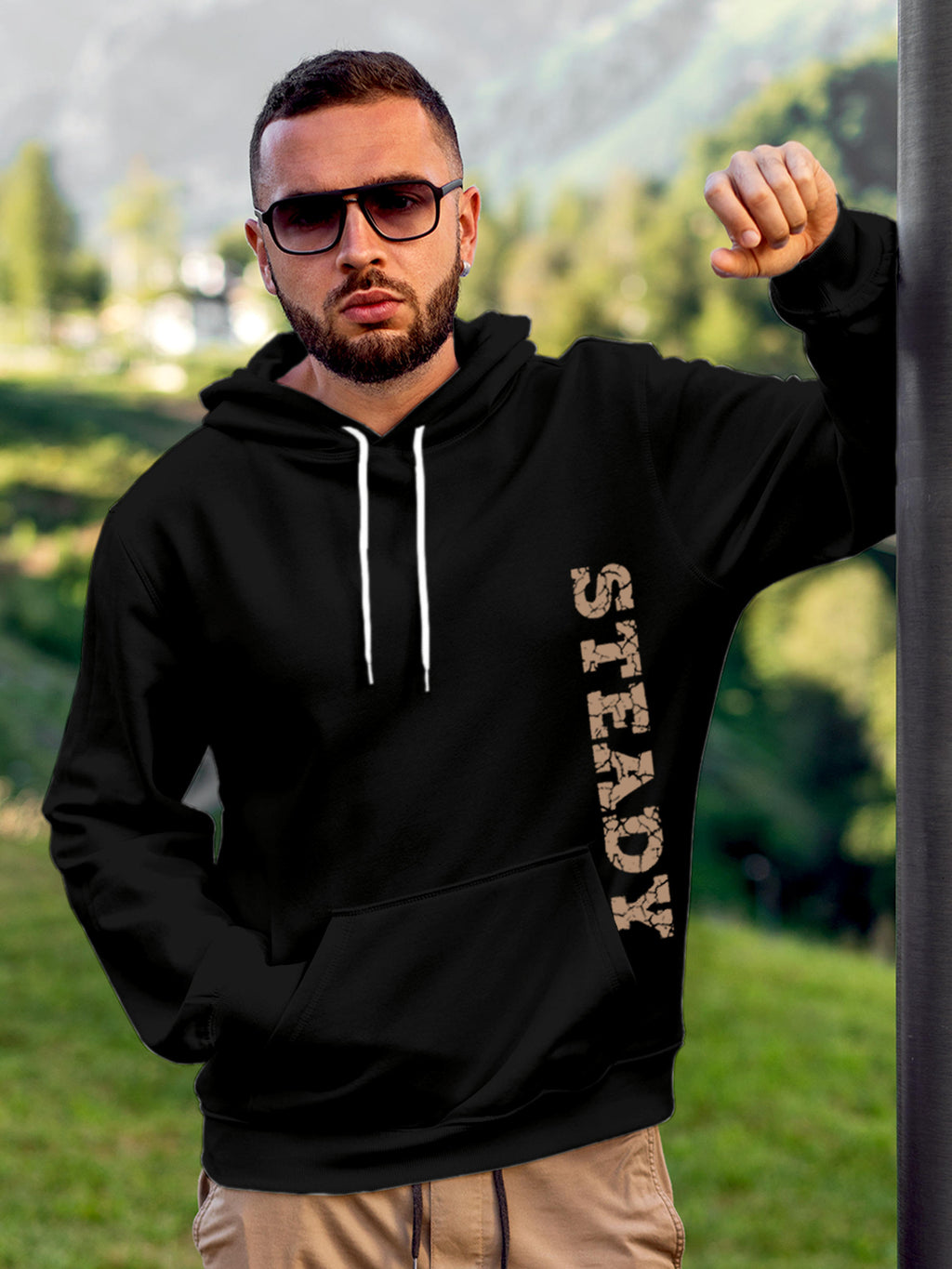 Model wearing Men's Black Hoodie Sweatshirt with 'Steady' design, offering effortless style and premium comfort