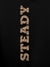 Close up of 'Steady' design on Men's Black Hoodie Sweatshirt, highlighting intricate details and vibrant print.