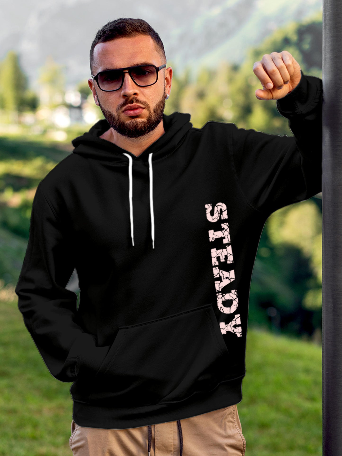 Model wearing Men's Black Hoodie Sweatshirt with 'Steady' design, offering effortless style and premium comfort
