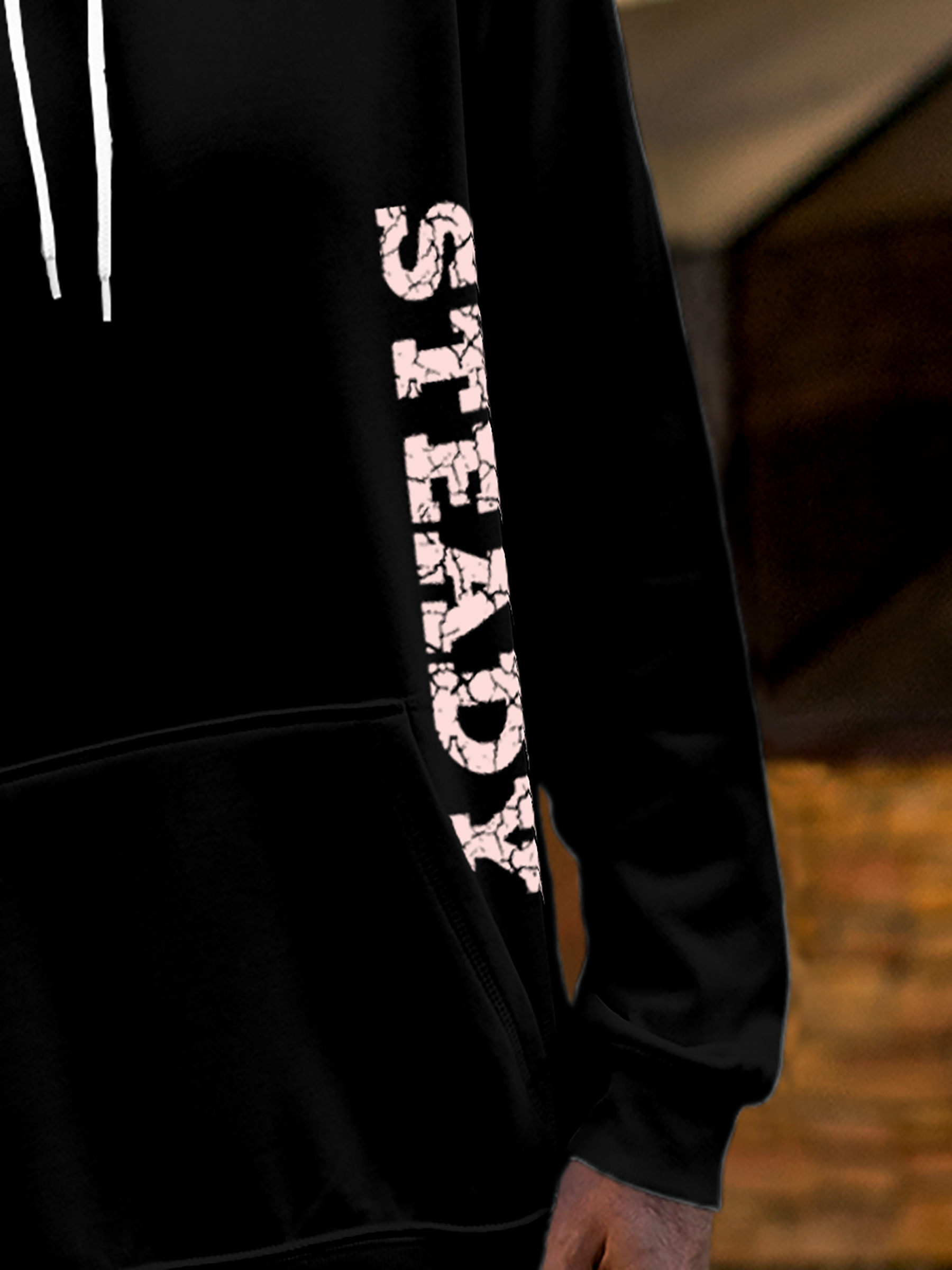 Close up of 'Steady' design on Men's Black Hoodie Sweatshirt, highlighting intricate details and vibrant print.