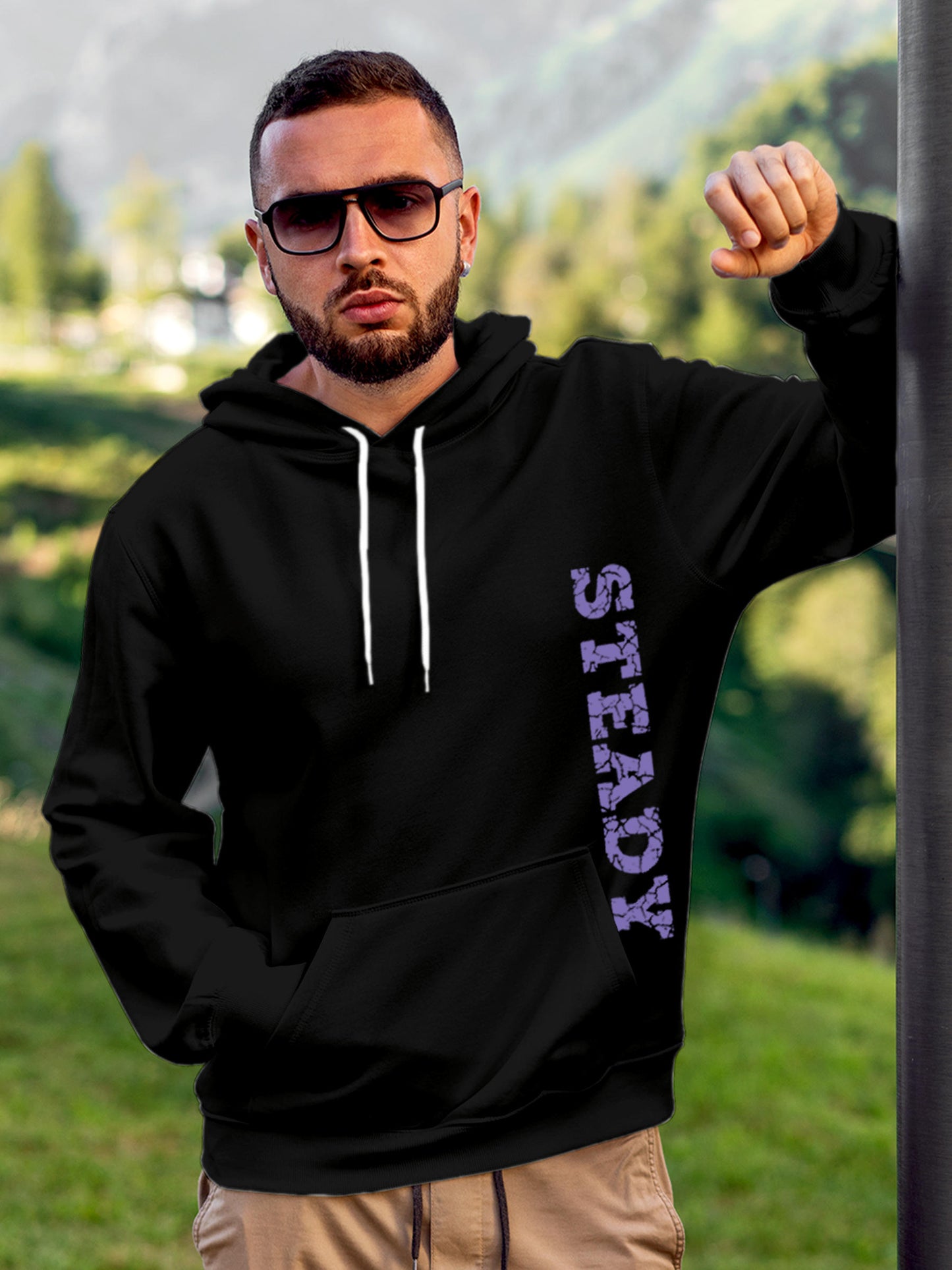 Model wearing Men's Black Hoodie Sweatshirt with 'Steady' design, offering effortless style and premium comfort