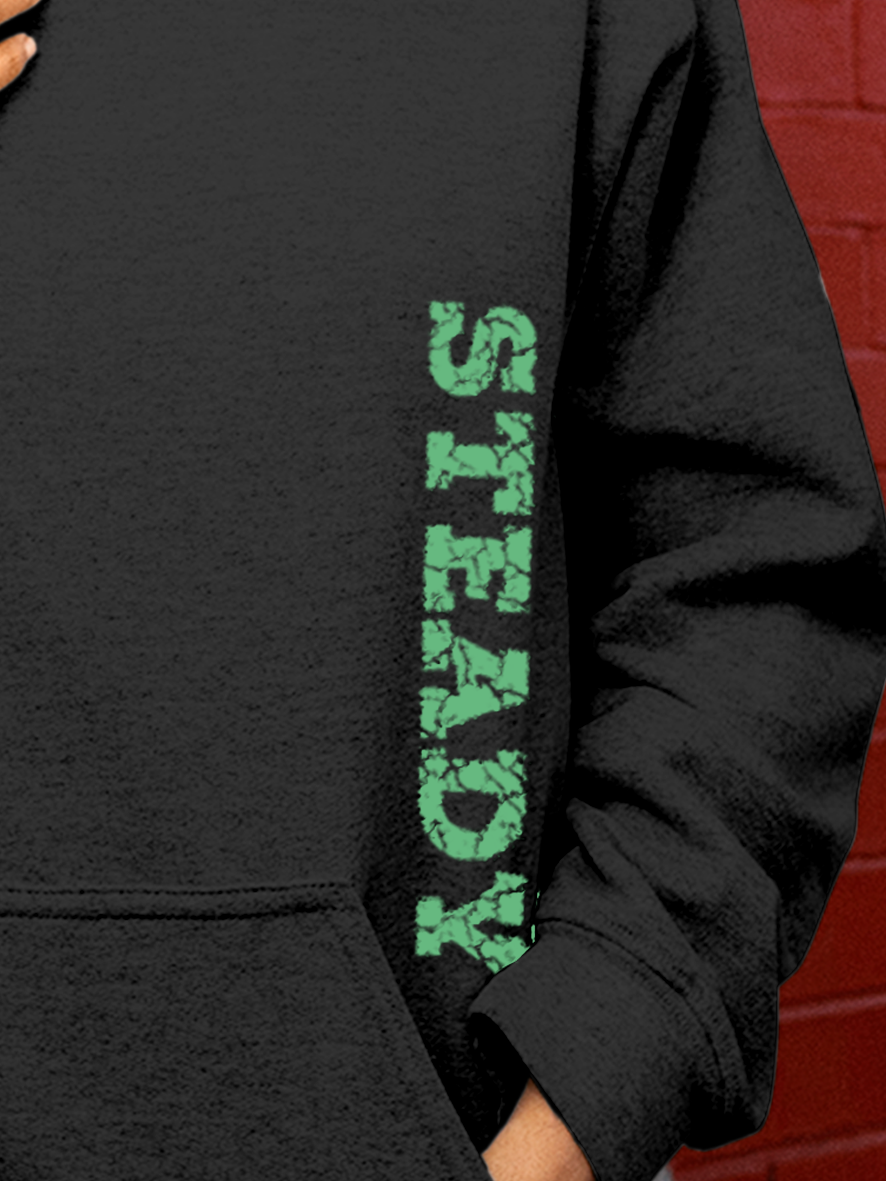Close up of 'Steady' design on Women's Charcoal Grey Hoodie Sweatshirt, highlighting intricate details and vibrant print.