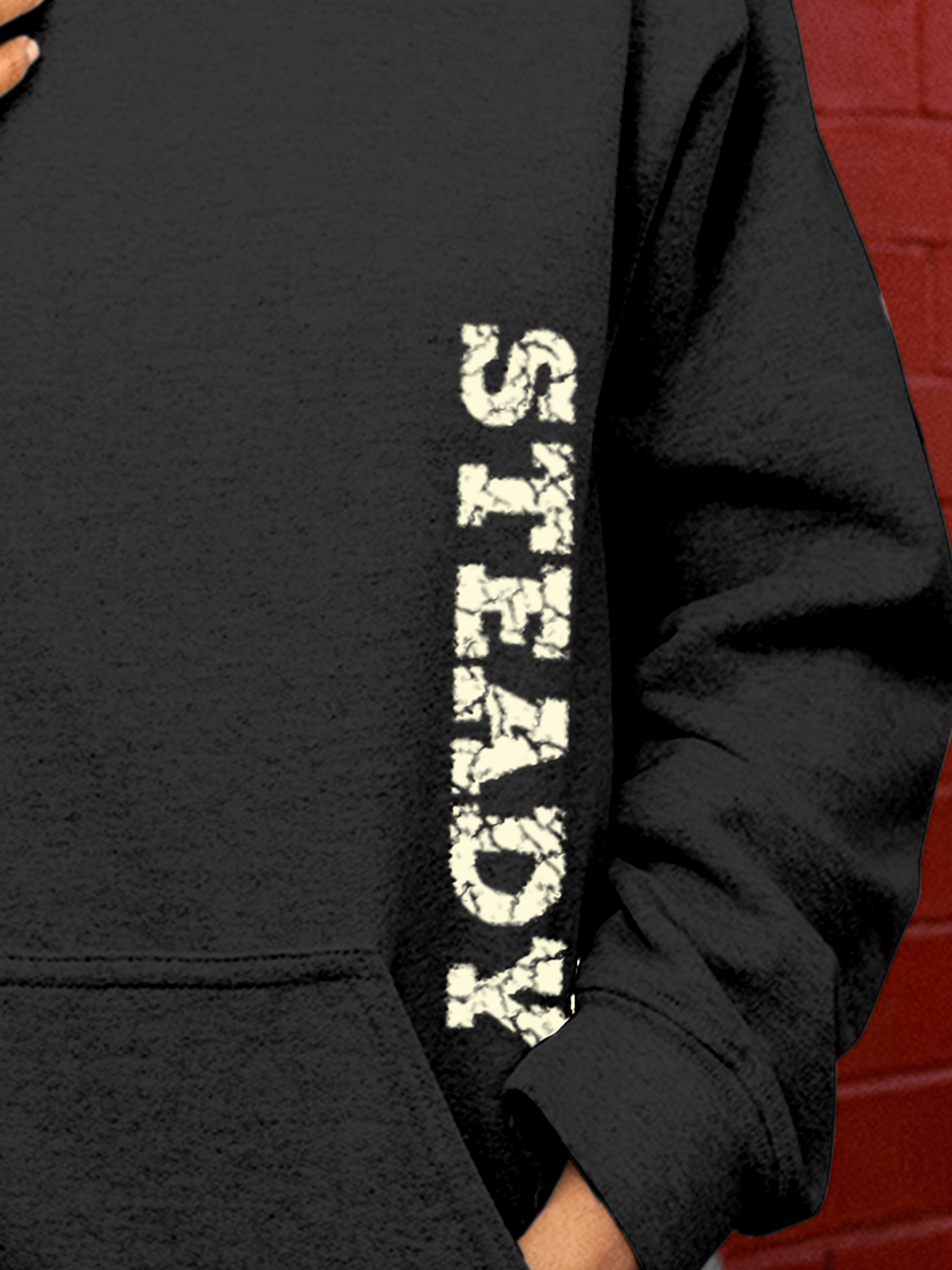 Close up of 'Steady' design on Women's Charcoal Grey Hoodie Sweatshirt, highlighting intricate details and vibrant print.