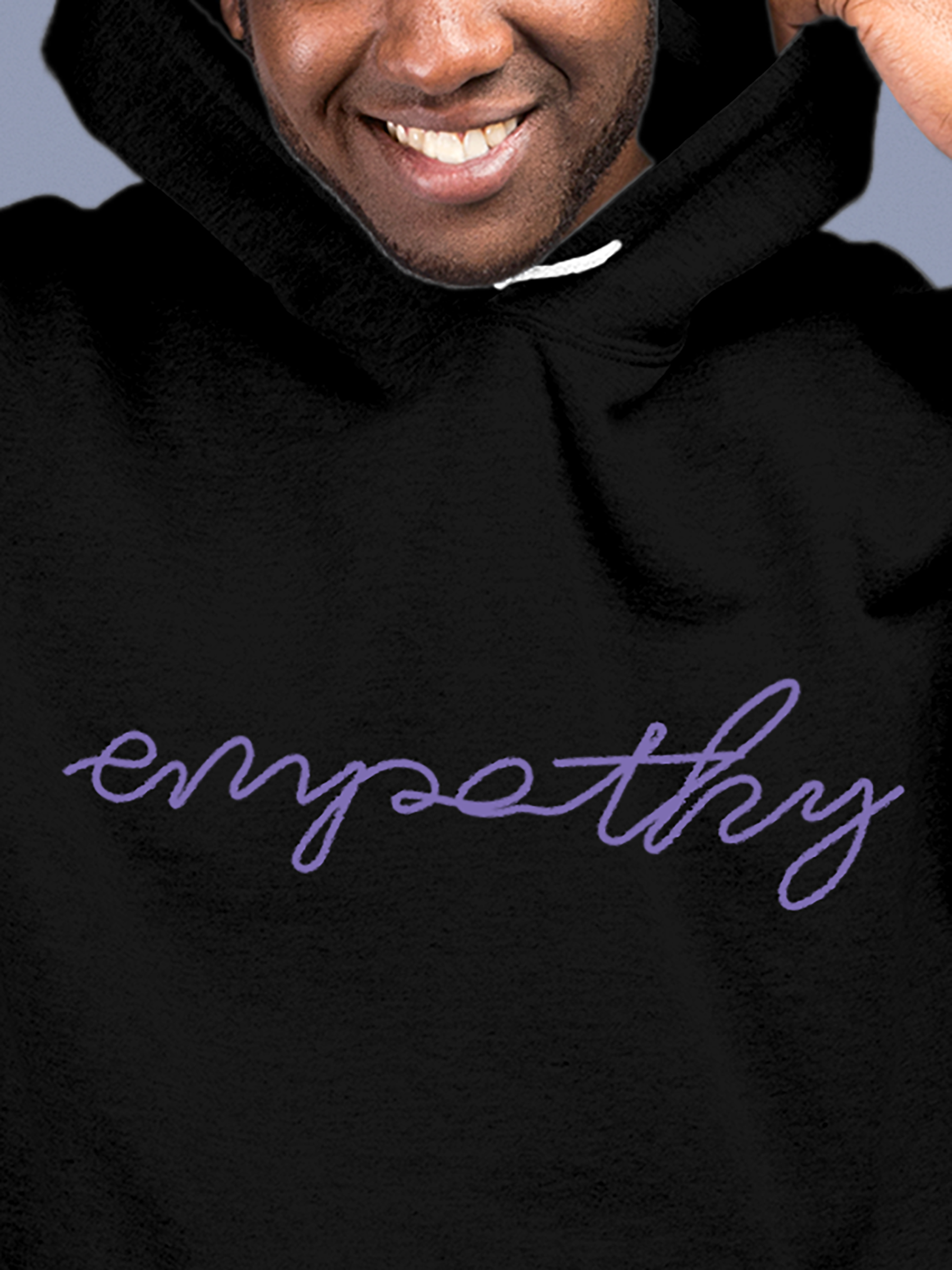 Close up of 'Empathy' design on Men's Black Hoodie Sweatshirt, highlighting intricate details and vibrant print.