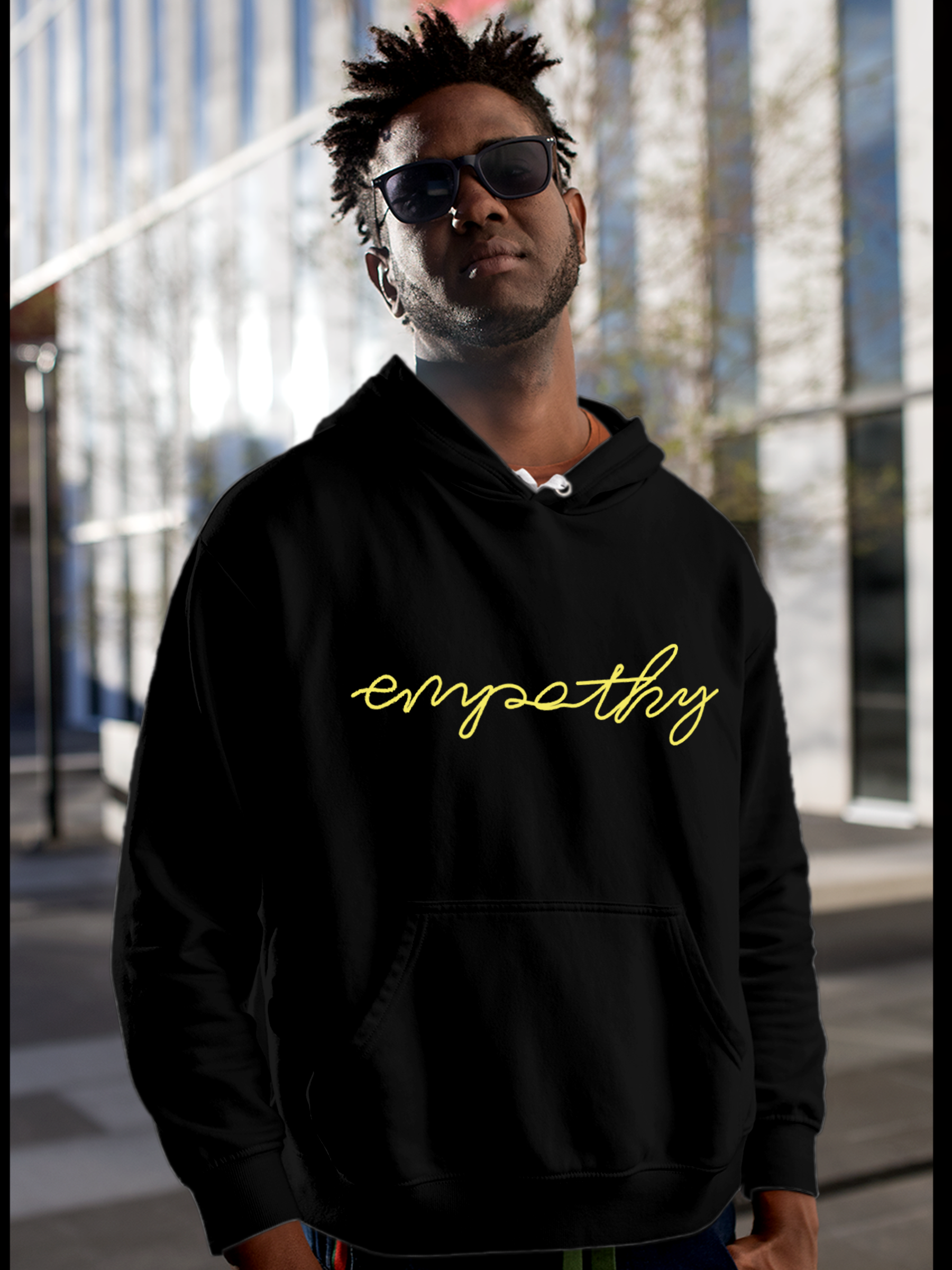 Fighterhero Hoodie Collection: Model wearing Men's Black Hoodie Sweatshirt with 'Empathy' design