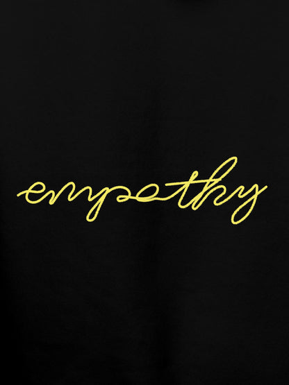 Close up of 'Empathy' design on Men's Black Hoodie Sweatshirt, highlighting intricate details and vibrant print.