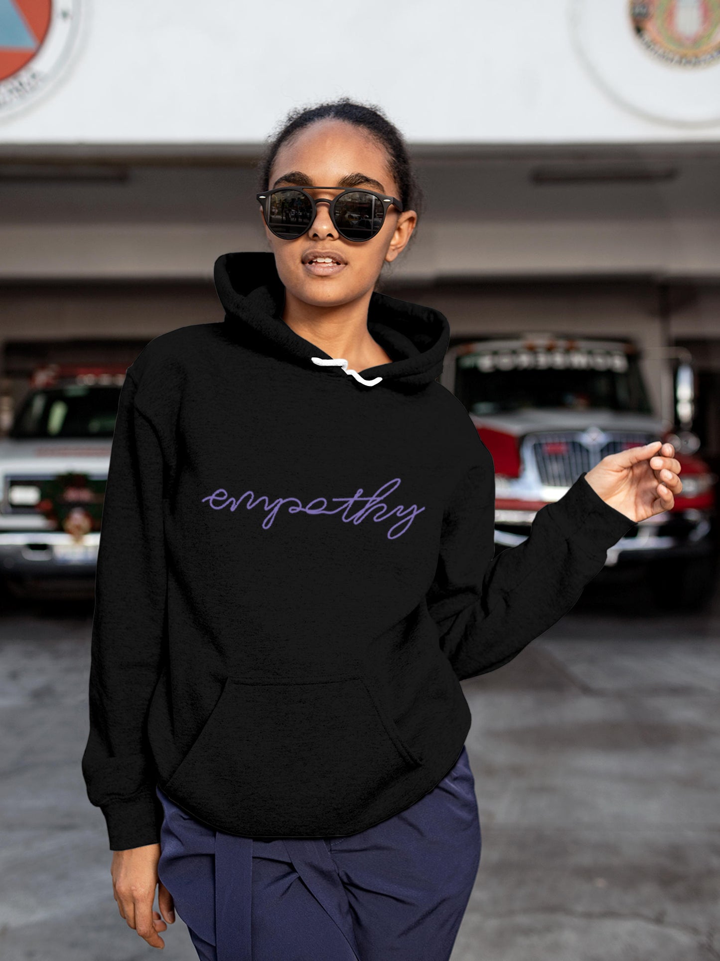 Model wearing Women's Black Hoodie Sweatshirt with 'Empathy' design, offering effortless style and premium comfort