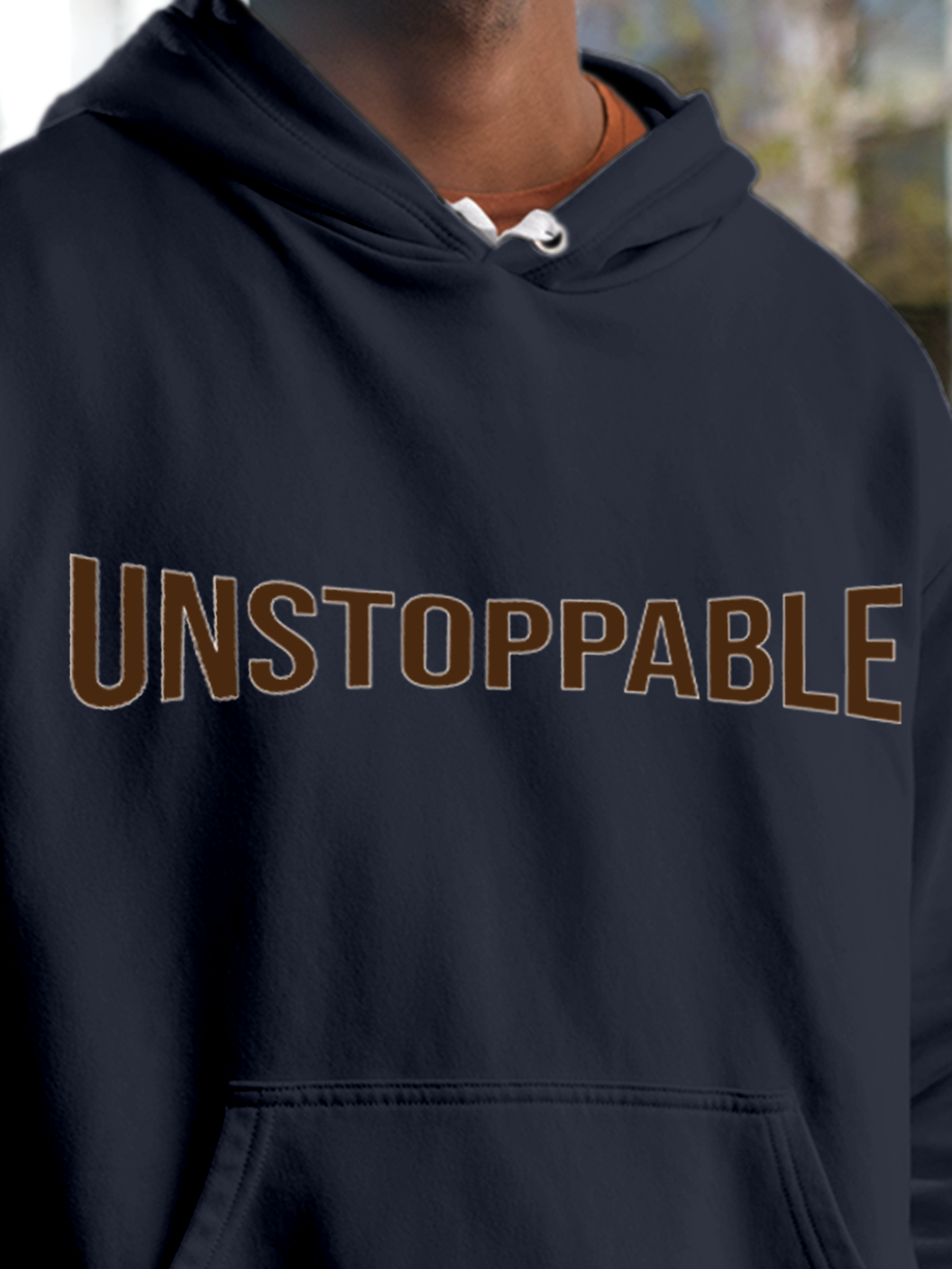 Close up of 'Unstoppable' design on Men's Navy Blue Hoodie Sweatshirt, highlighting intricate details and vibrant print.