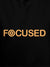 Close up of 'Focused' design on Men's Black Hoodie Sweatshirt, highlighting intricate details and vibrant print.