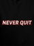 Close up of 'Never Quit' design on Women's Black Hoodie Sweatshirt, highlighting intricate details and vibrant print.