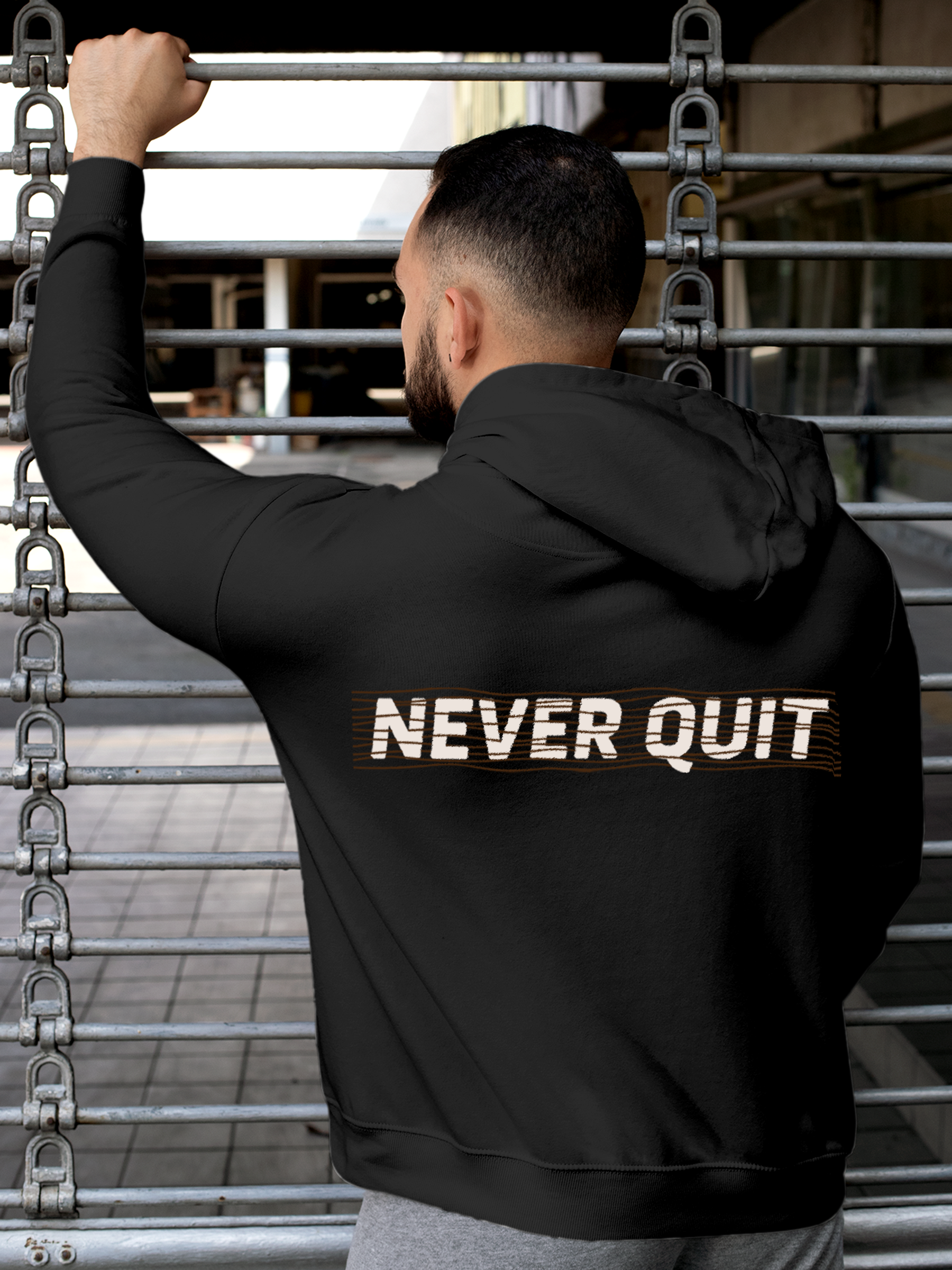 Model wearing Men's Charcoal Grey Hoodie Sweatshirt with 'Never Quit' design, offering effortless style and premium comfort