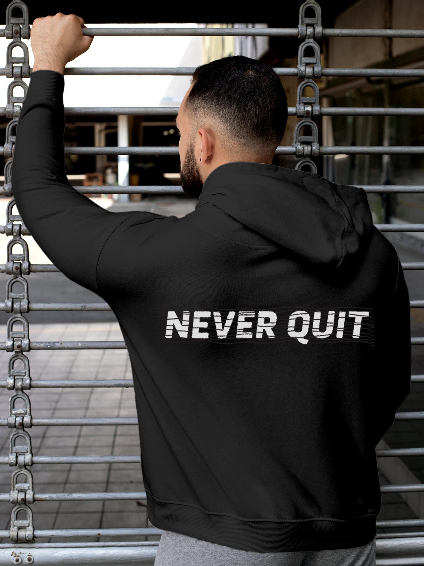 Model wearing Men's Dark Grey Hoodie Sweatshirt with 'Never Quit' design, offering effortless style and premium comfort